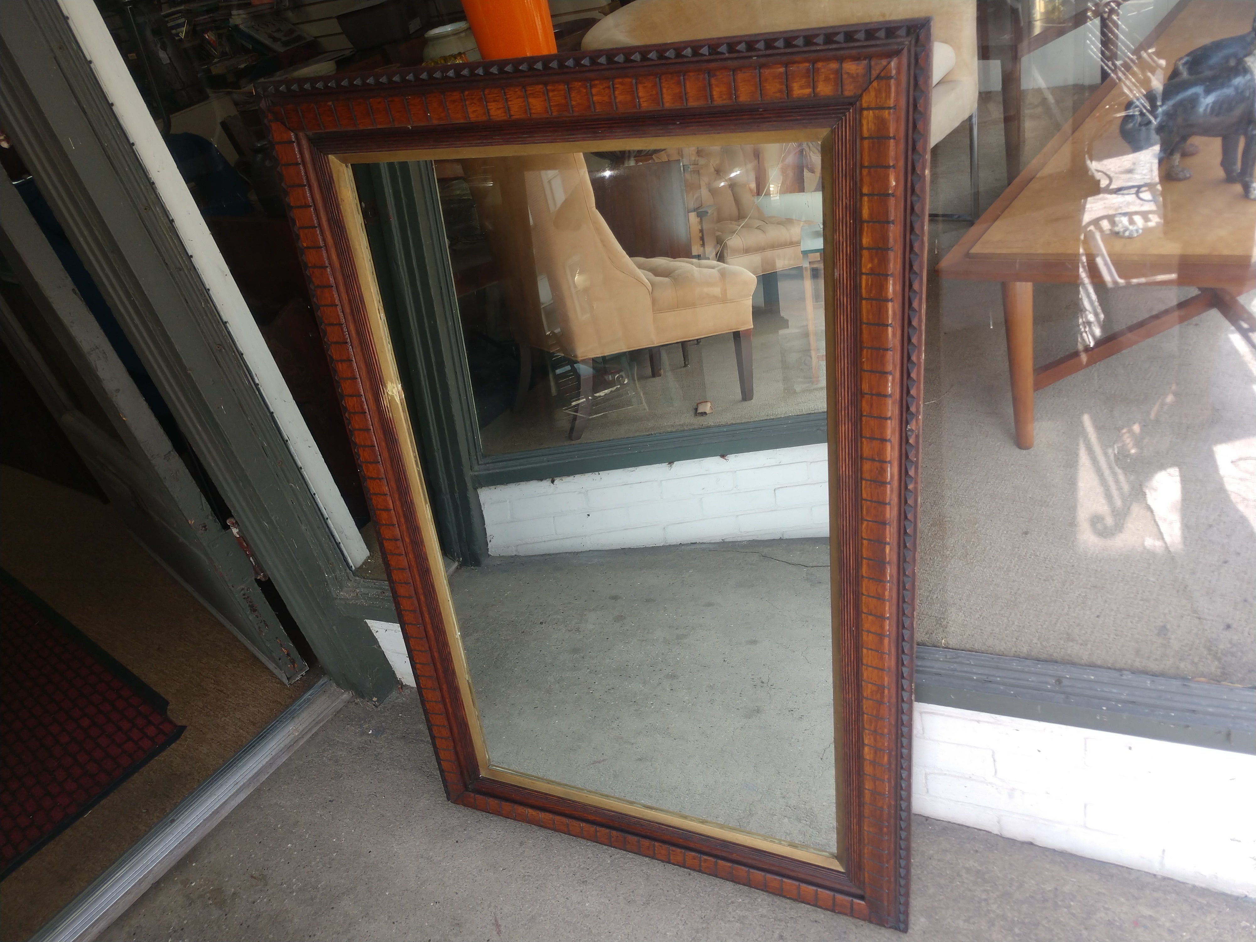 Brand new mirror surrounded by a fabulous walnut chip carved frame. Good size 48 x 31.5 inches. In very good condition with minimal wear, one blemish on the Gilt liner. Can be hung either way.