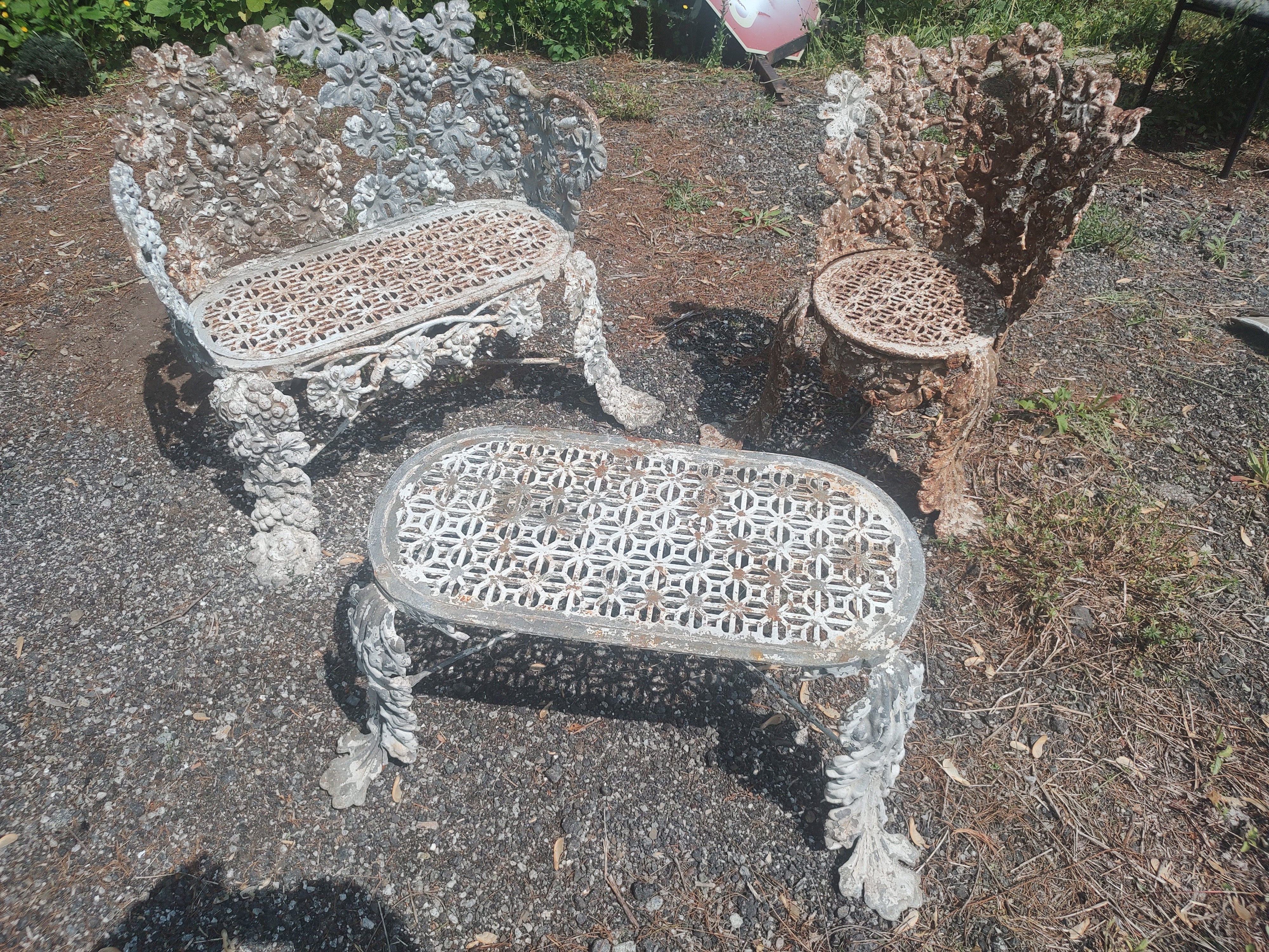 Fabulous 3 piece set of Cast Iron garden seating with table. A bench a chair and a converted bench minus it's back that can be used as a table. All three in outstanding antique condition with no visible damage or missing pieces. Very ornate with a