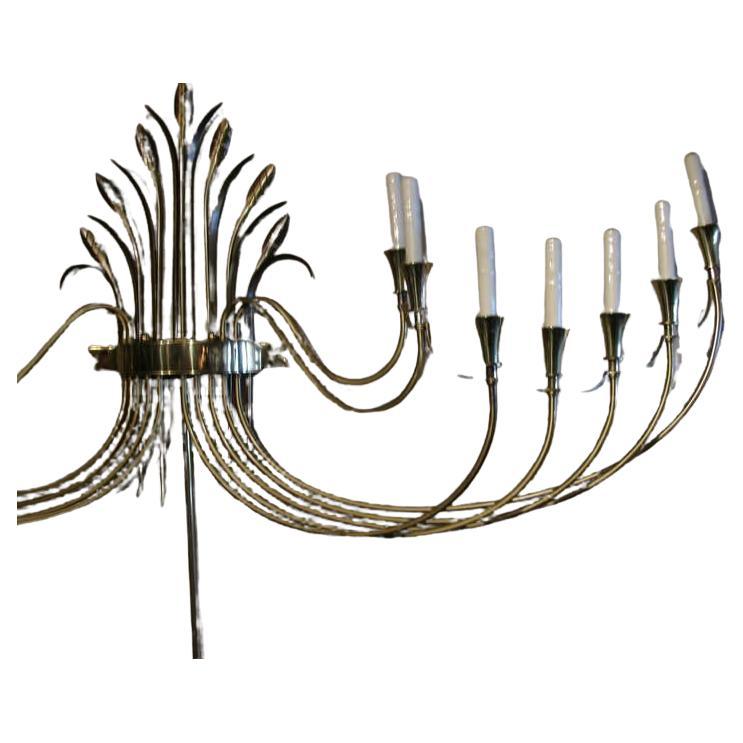 Classical brass sconce nearly five feet in width with fourteen lights. Originally from a NYC hotel lobby. Excellent craftsmanship and condition with minimal wear and enormous style. 