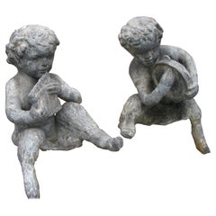 Paire de figurines de jardin en zinc et plomb du début du XXe siècle