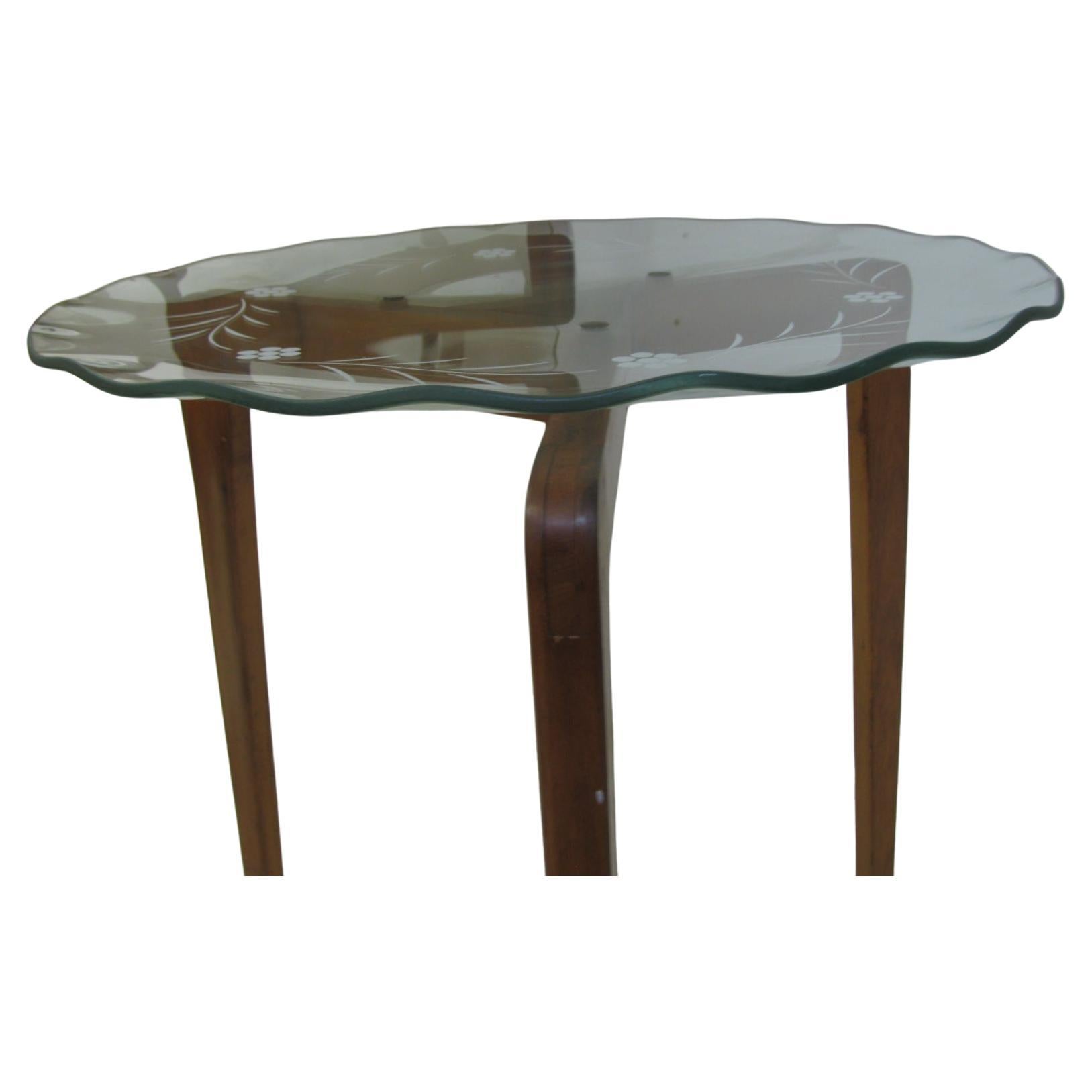 Amazing set of 3 glass top tables. Glass tops are in excellent condition with no chips. They have a decorative leaf motif etched in the glass with a wavy edge. Tops are securely mounted to the hardwood frames with bronze hardware and gaskets. Wood