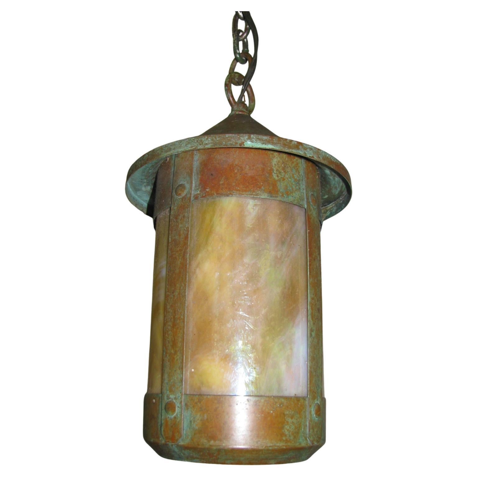 Beautiful pendant lamps with cream colored bent slag glass in round copper housing. Copper has developed a slight verdigris patina. 4ft of heavy link chain currently affixed to lamps, this can be shortened to meet your requirements. Original copper