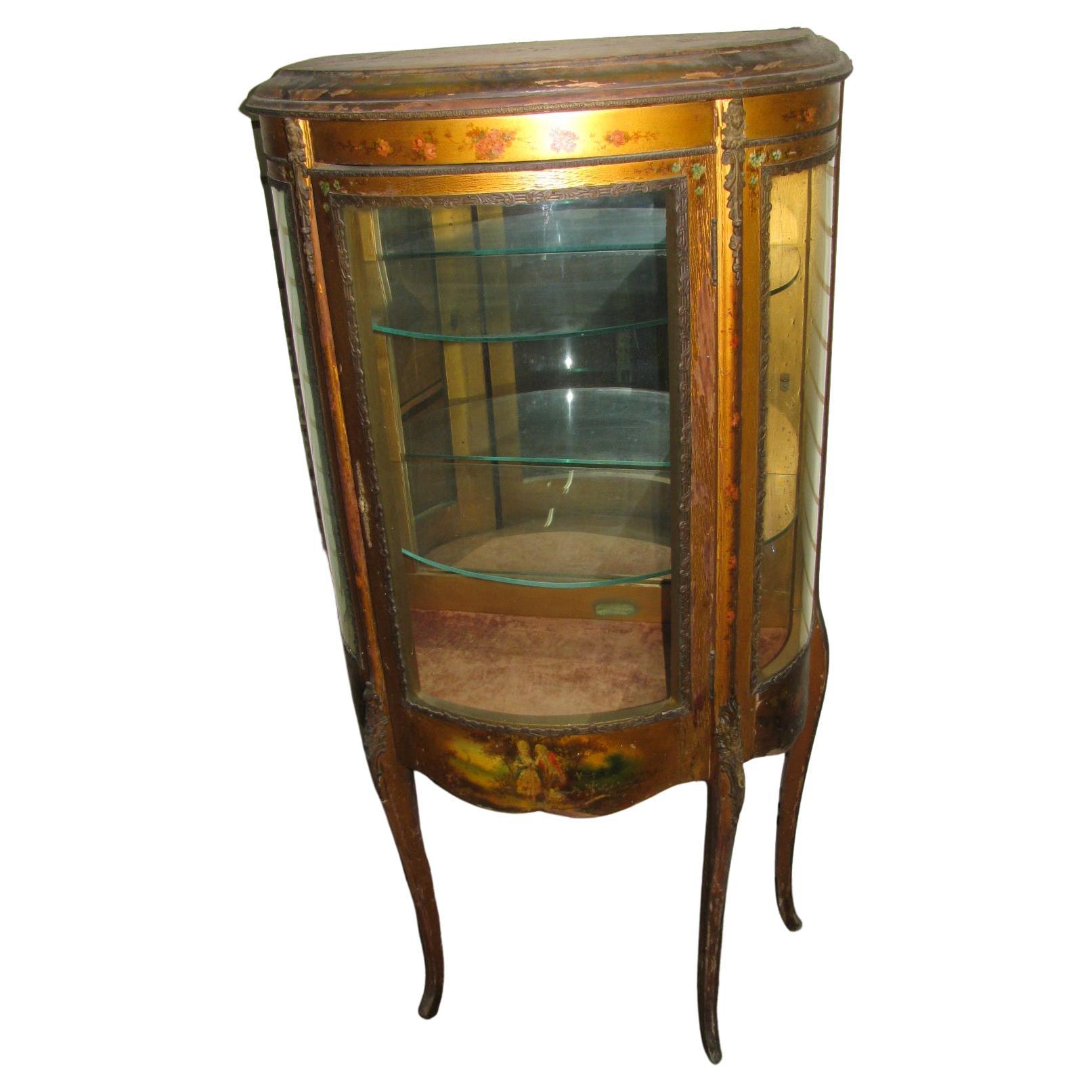 Distressed paint but structurally sound and tight, Vernis Martin vitrine with hand painted panels, bronze mounts and curved glass. Has working lockset & key. Three glass shelves all original. In excellent vintage condition with wear to the Gilt as