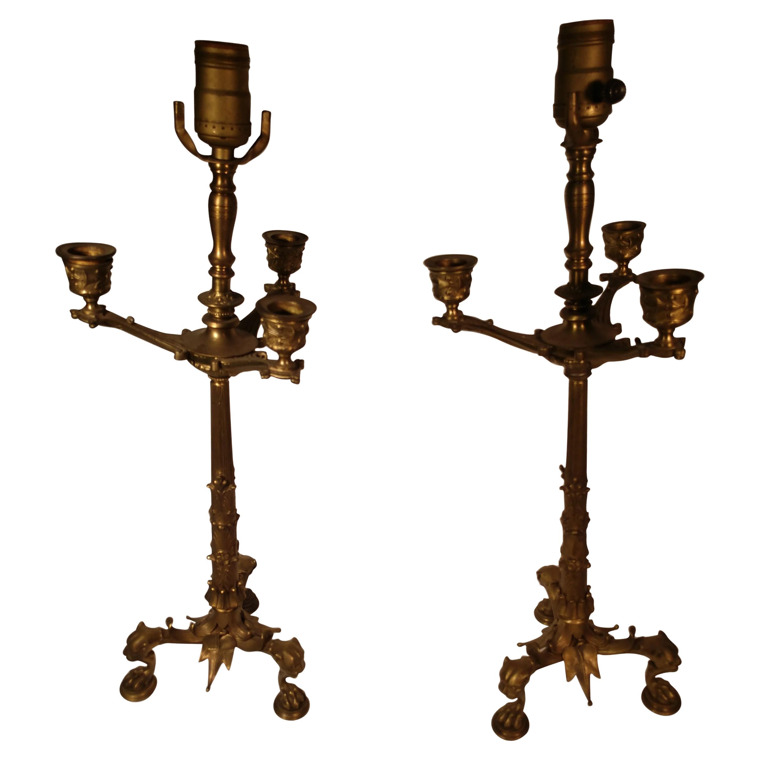 Beautiful pair of mid-19th century brass figural candlestick holders converted to electric. Lions heads featured, finely crafted, great castings.