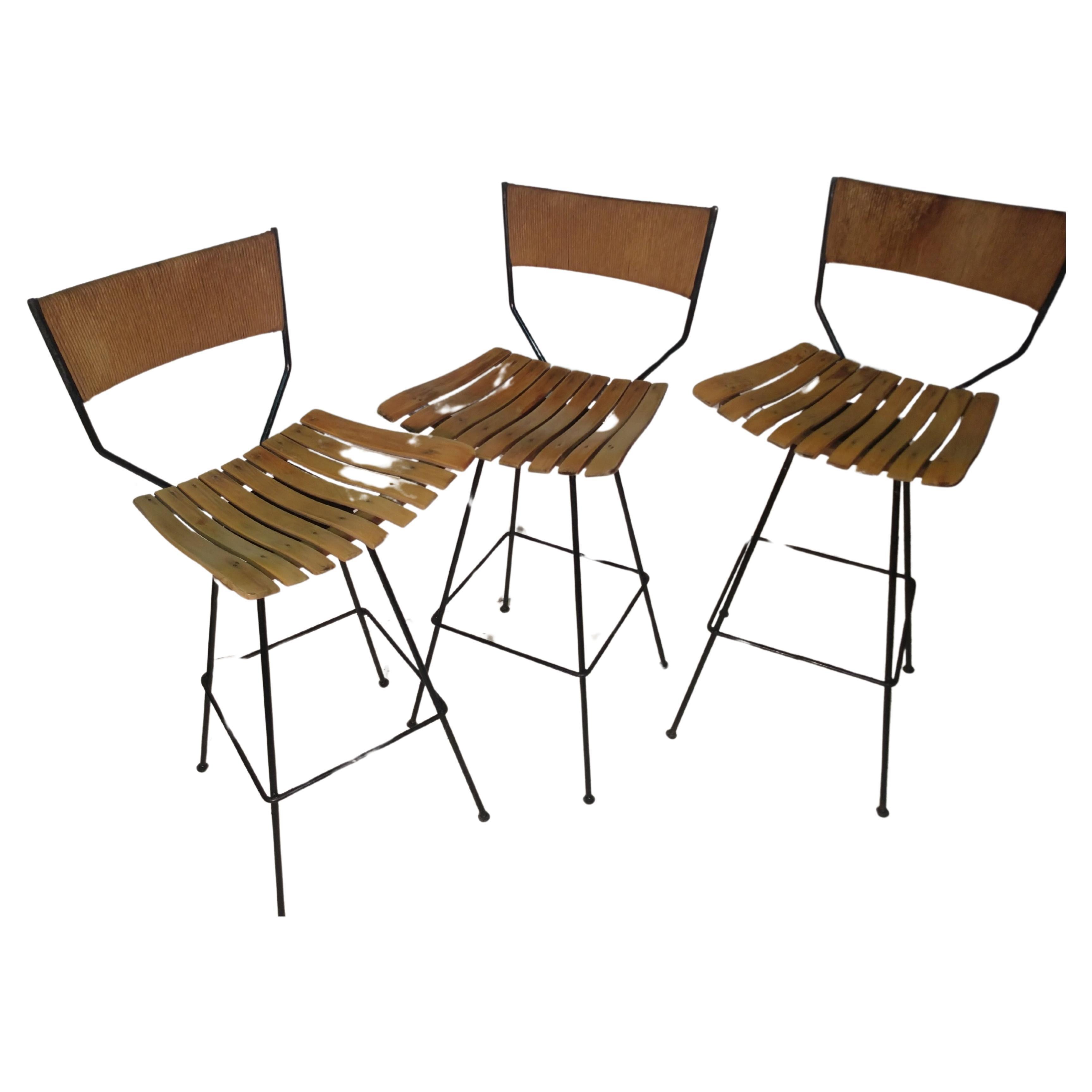 American Pair of Mid Century Modern Iron with Maple and Raffia Bar Stools Arthur Umanoff For Sale