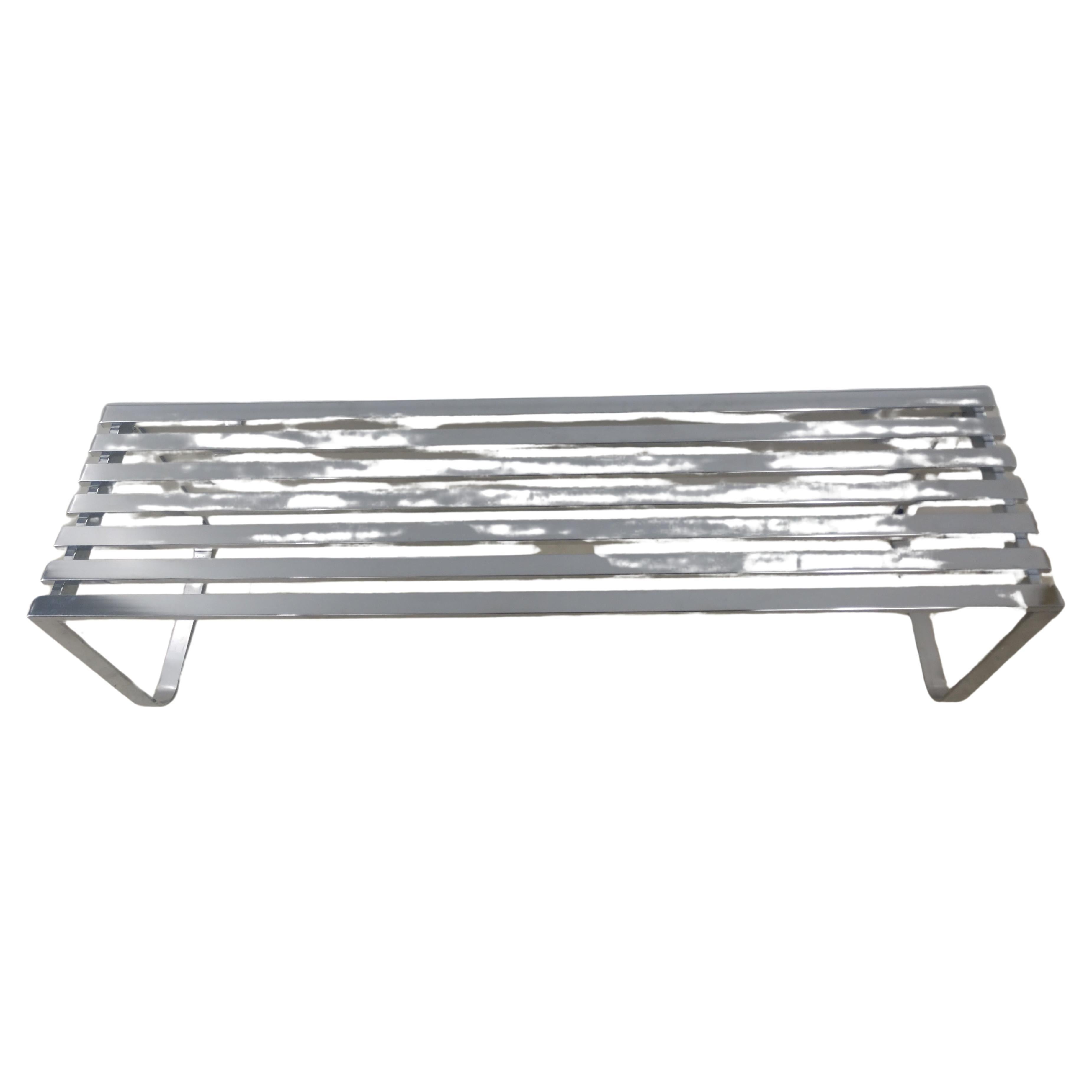 Simple and elegant nickel chrome slatted cocktail table and or bench. 5ft long by 16.5 wide provides a bit of glamour to the room. In excellent vintage condition with some minor wear to the slats, no pitting or rust. 