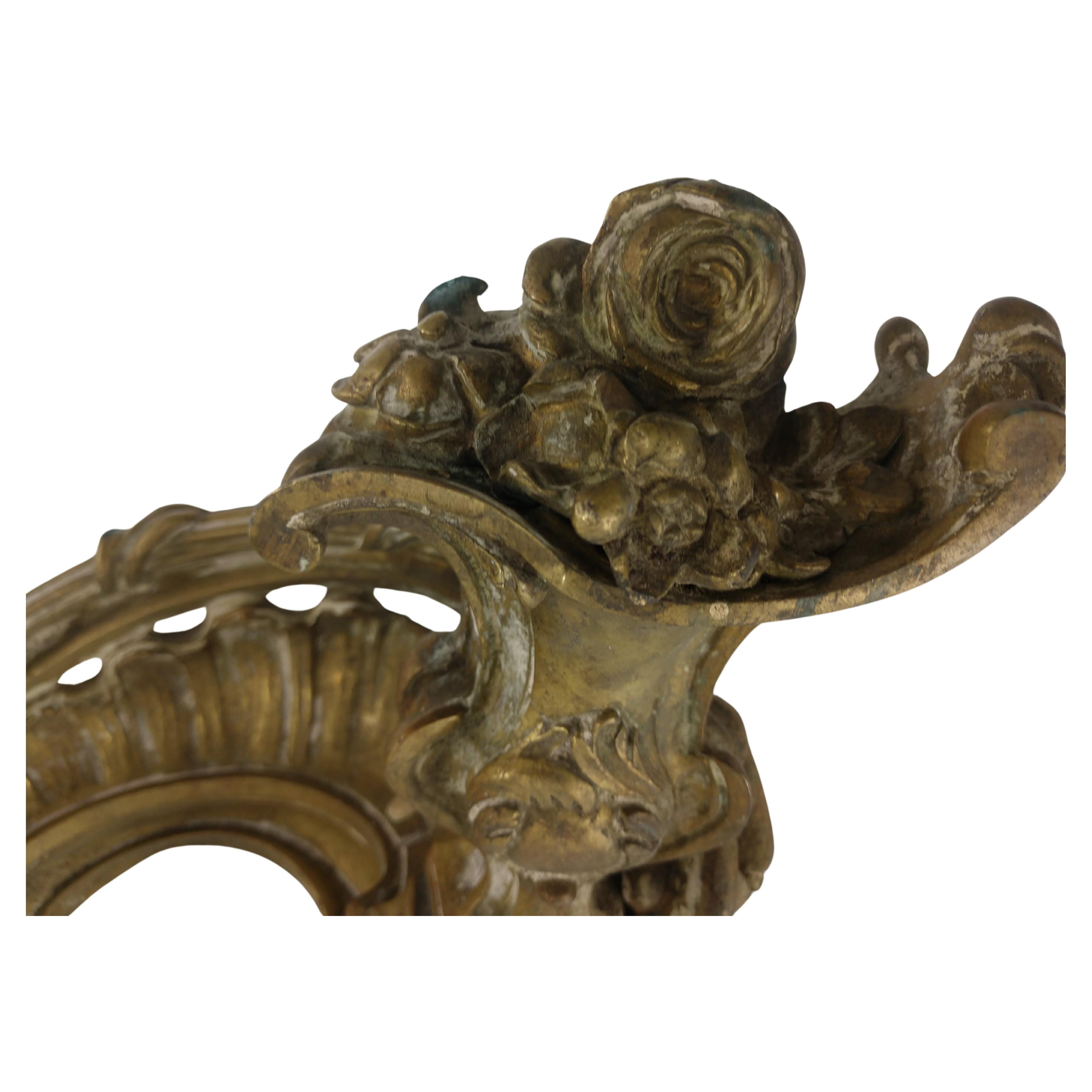 Beautifully detailed bronze casting of a pair of Chenets in a swirling bouquet design, very organic.