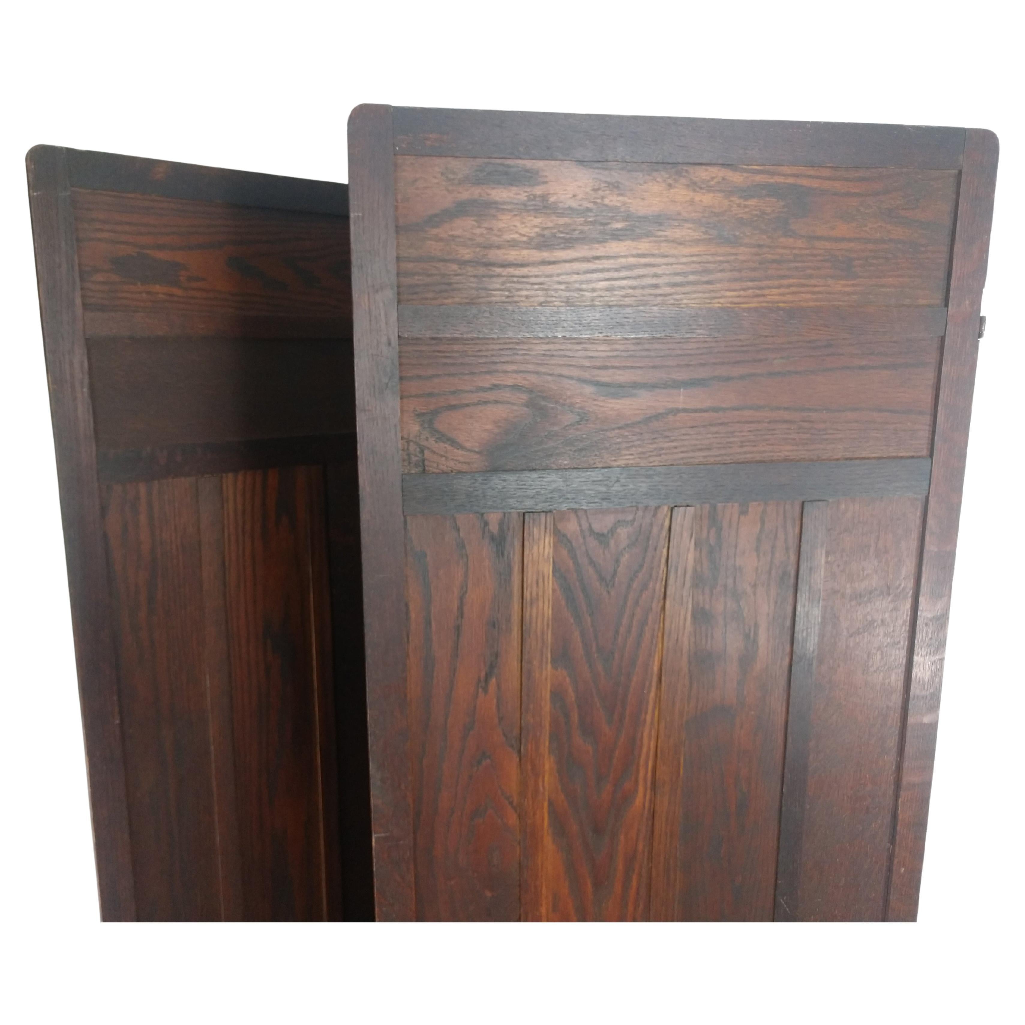 Period arts & crafts screen created from quarter sawn oak in a dark finish. In original condition with minimal wear. Simple and elegant work. This item folds flat, each panel is 19.75 inches wide by 68.25 high. Can be parcel posted. 
 