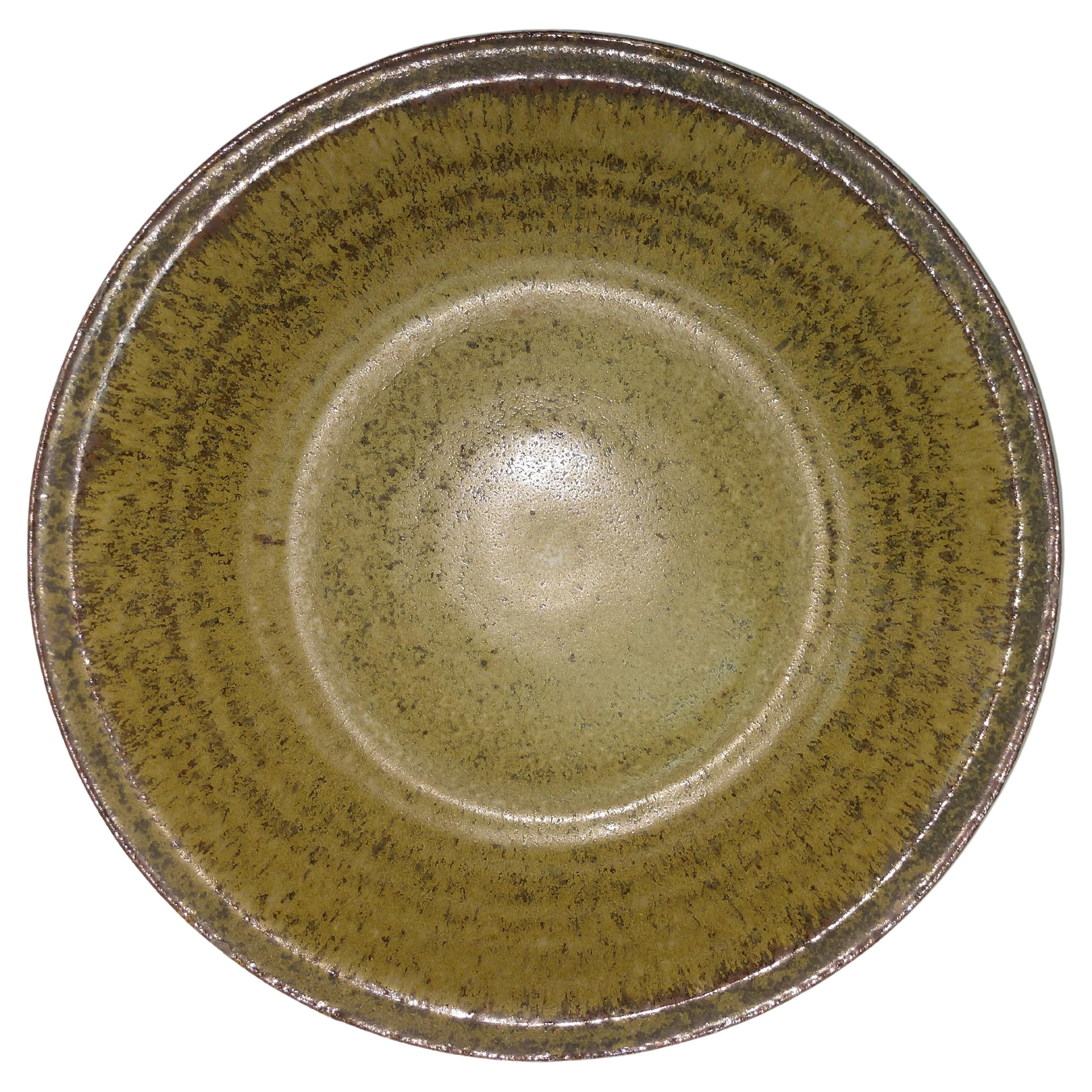 Fabulous mottled green with brown edged charger. Concentric ribs outline the dish. Truly a beautiful piece. Signed HS. Herbert Sargent. Measures: 3