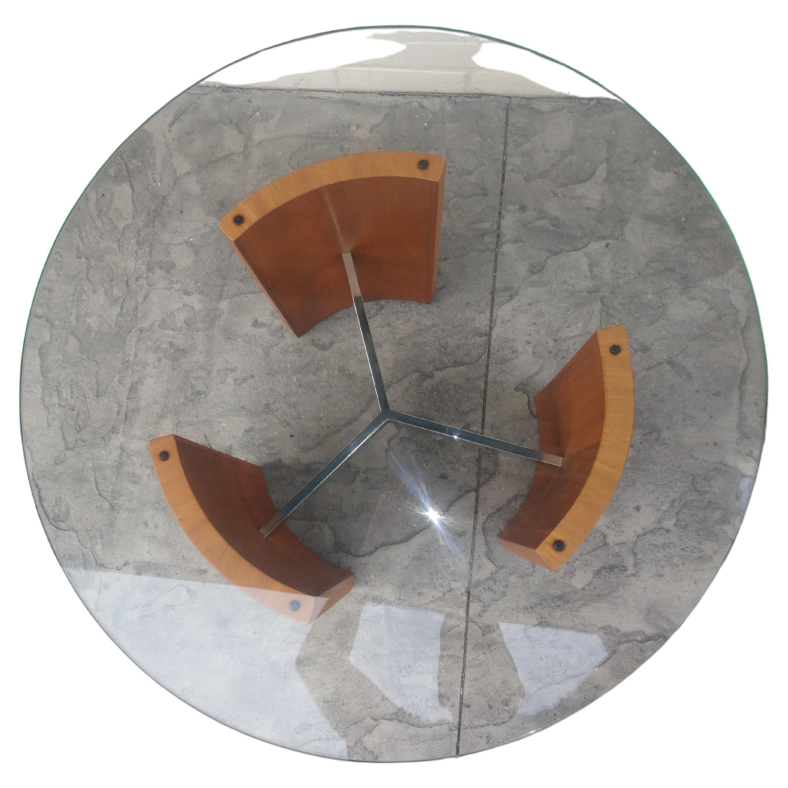 Exceptional and a beautiful table designed by Vladimir Kagan. Created from curved walnut panels connected by a polished chrome tri-star designed spoke. Glass is flawless.