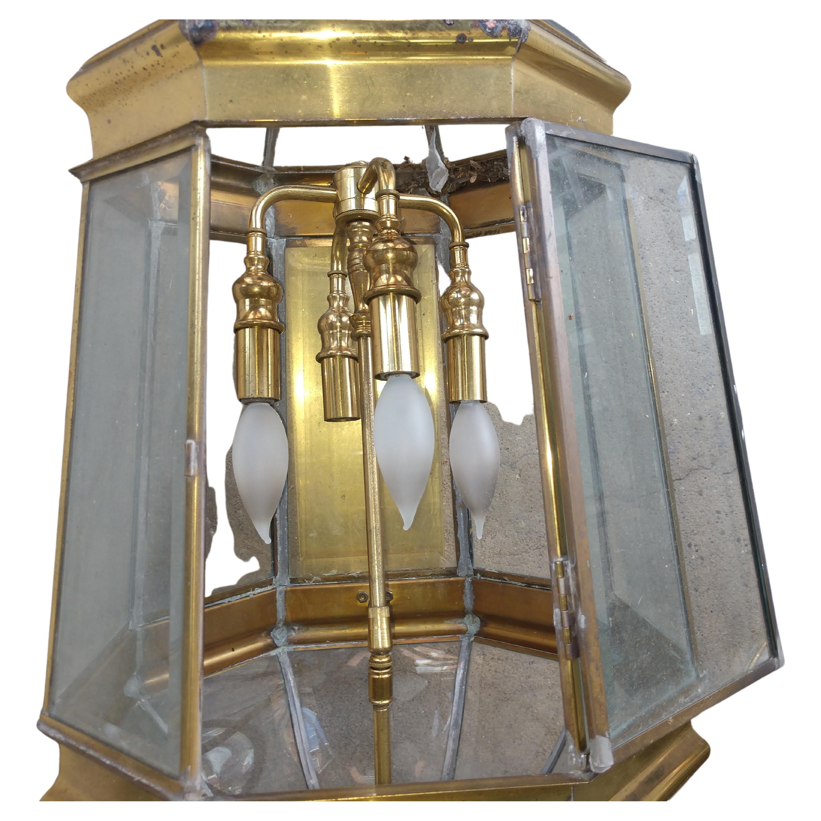 Exceptional large pair, 40 inches tall by 12 inches in diameter. Brass with Beveled Glass on 8 sides. In excellent vintage condition with minimal wear, see photos. Sold and priced as a pair.
Quality workmanship. 4 light hanging chandelier in each