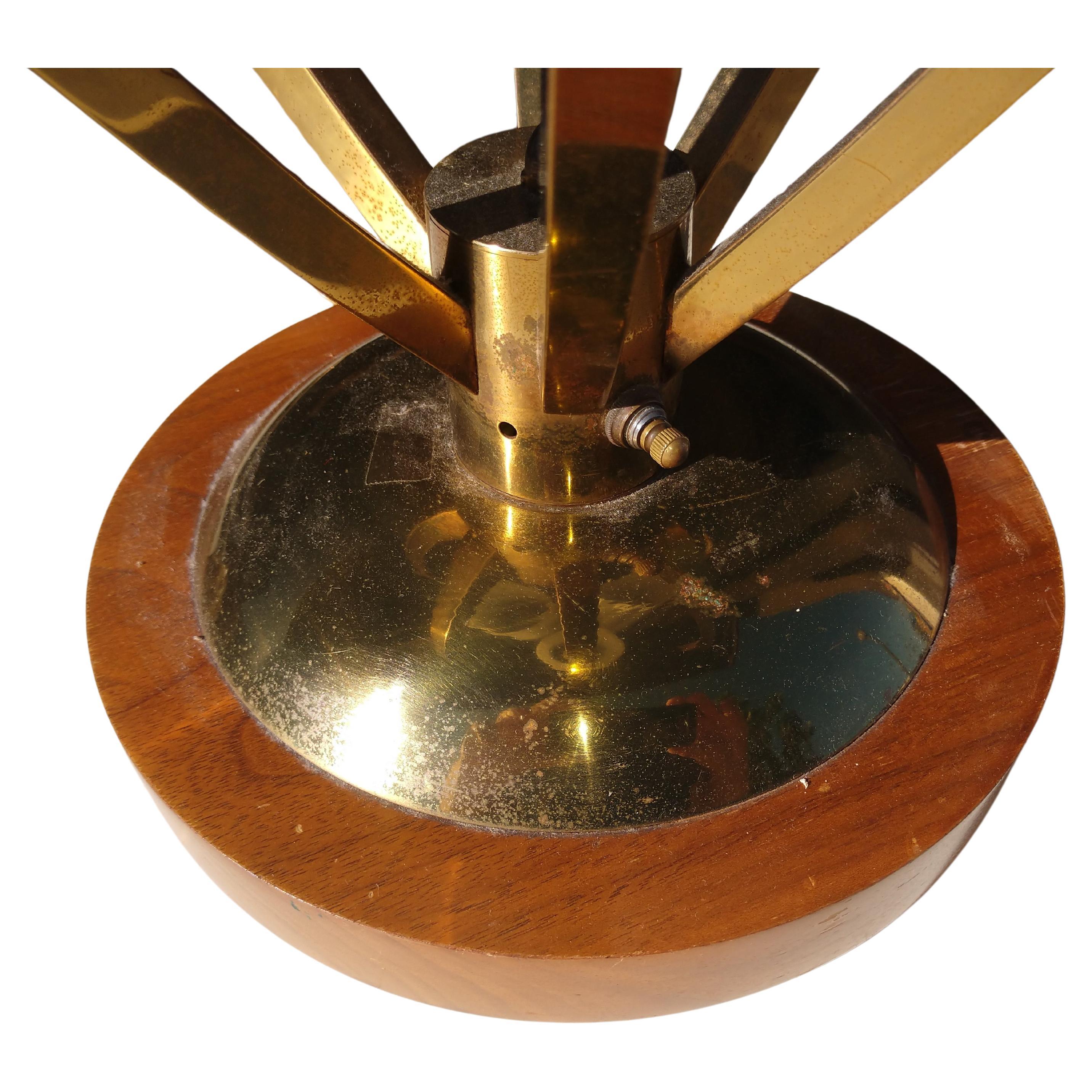 Fabulous 3 way lamp. Switch provides lighting for one, two or all three shades to be lit simultaneously. Brass open Ovoid like housing with 3 frosted glass shades suspended by brass rods. Shades are hung at 3 different heights. Large piece, 38.5