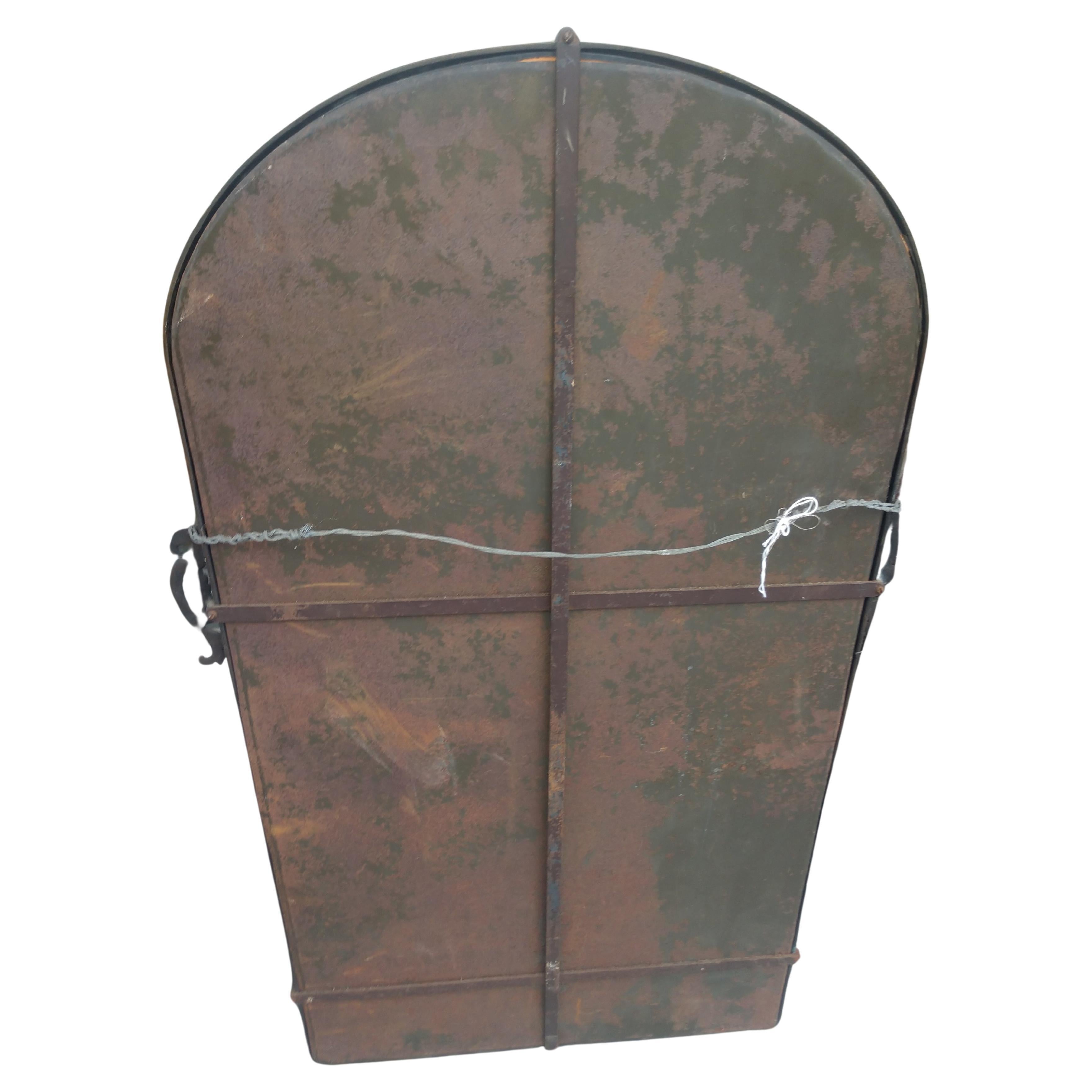 arched bronze mirror