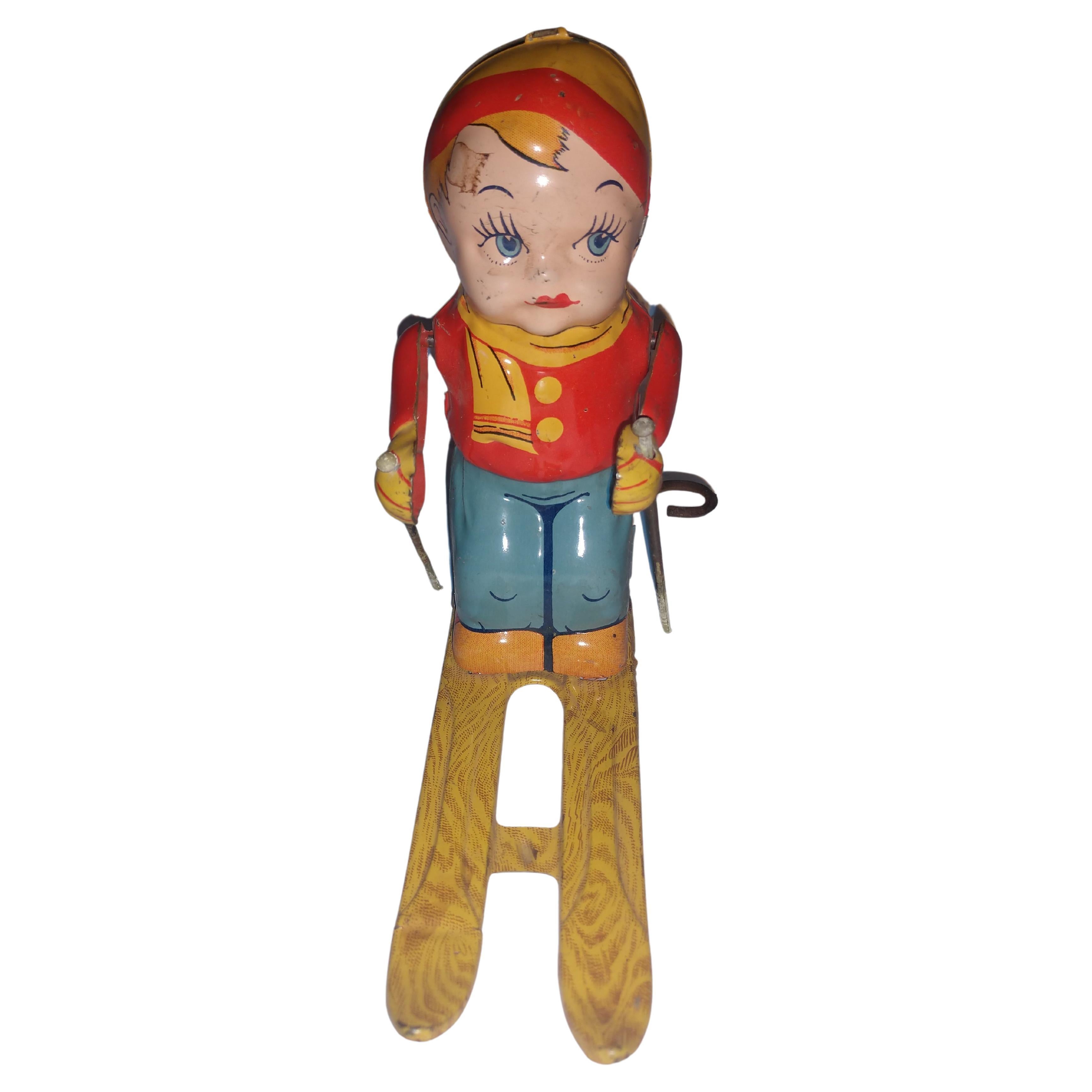 Fabulous working tin Litho toy skier by the Chein toy co. C1945. In excellent vintage condition with minimal wear.