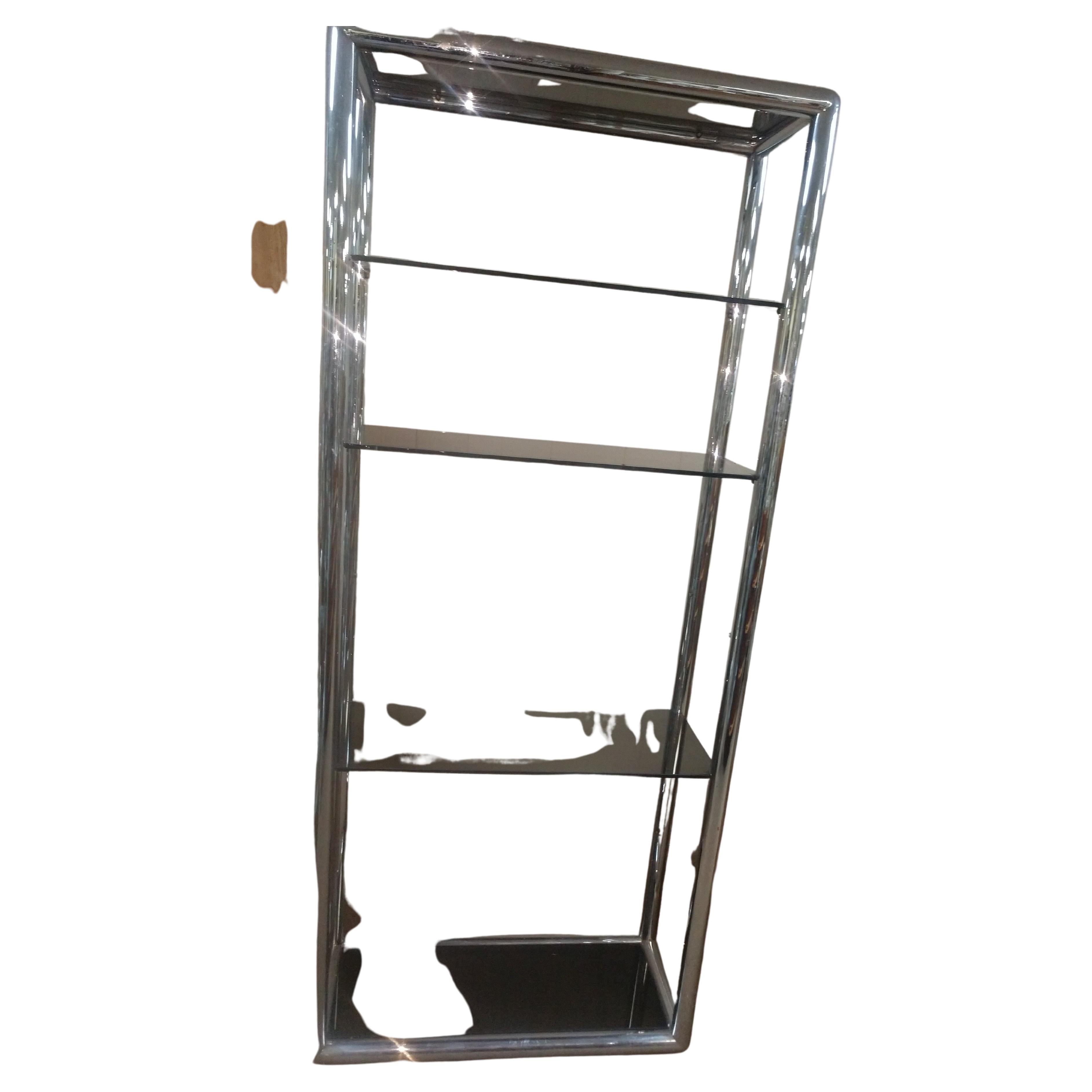 Simple and elegant etagere in a chunky tube chromed with smoked glass. Welded smooth corners with multiple chrome coatings. Scratches to glass with a few chips. Minor age related wear to chrome. Five shelves include the top and bottom.