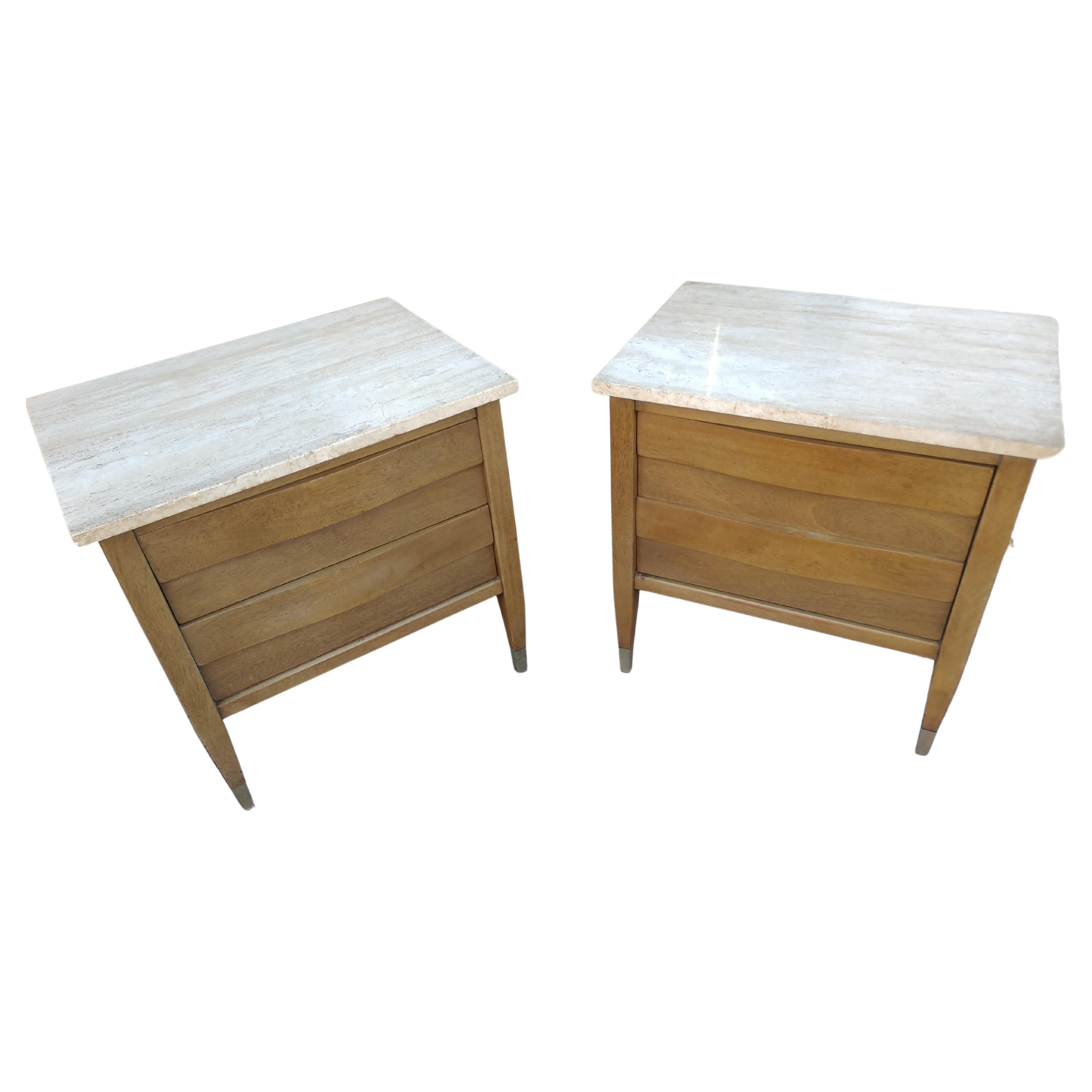 Fantastic 2 drawer end tables or night stands by American of Martinsville with Travertine marble tops. Curved wave front design to drawers. Nickel sabots on the legs. In excellent vintage condition with minimal wear. Only issues to speak of, very