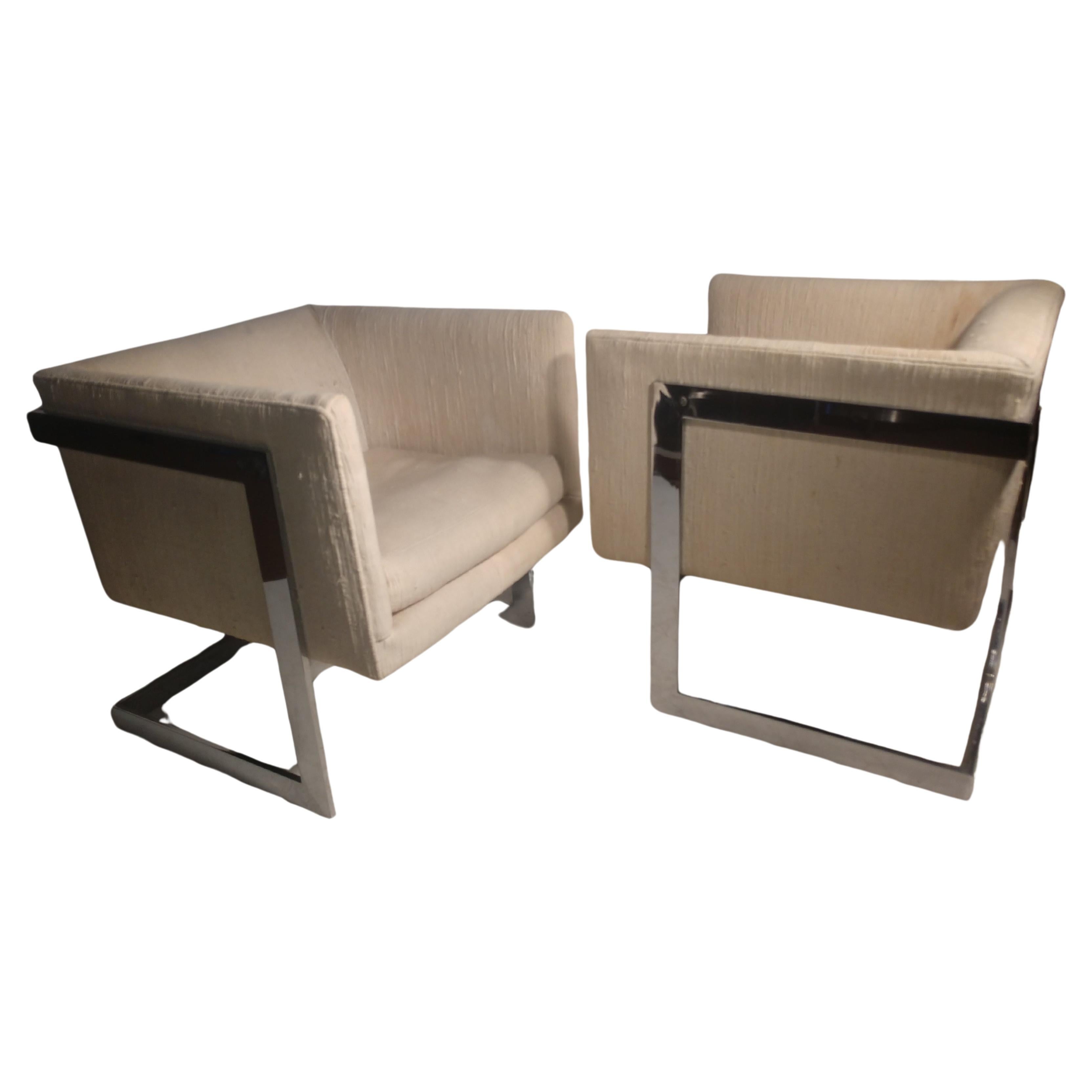 Simple and elegant pair of Mid-Century Modern cube chairs by Milo Baughman for Thayer Coggin. Sold by Bloomingdales New Rochelle NY. In excellent vintage condition with minimal wear. Fabric is stained.