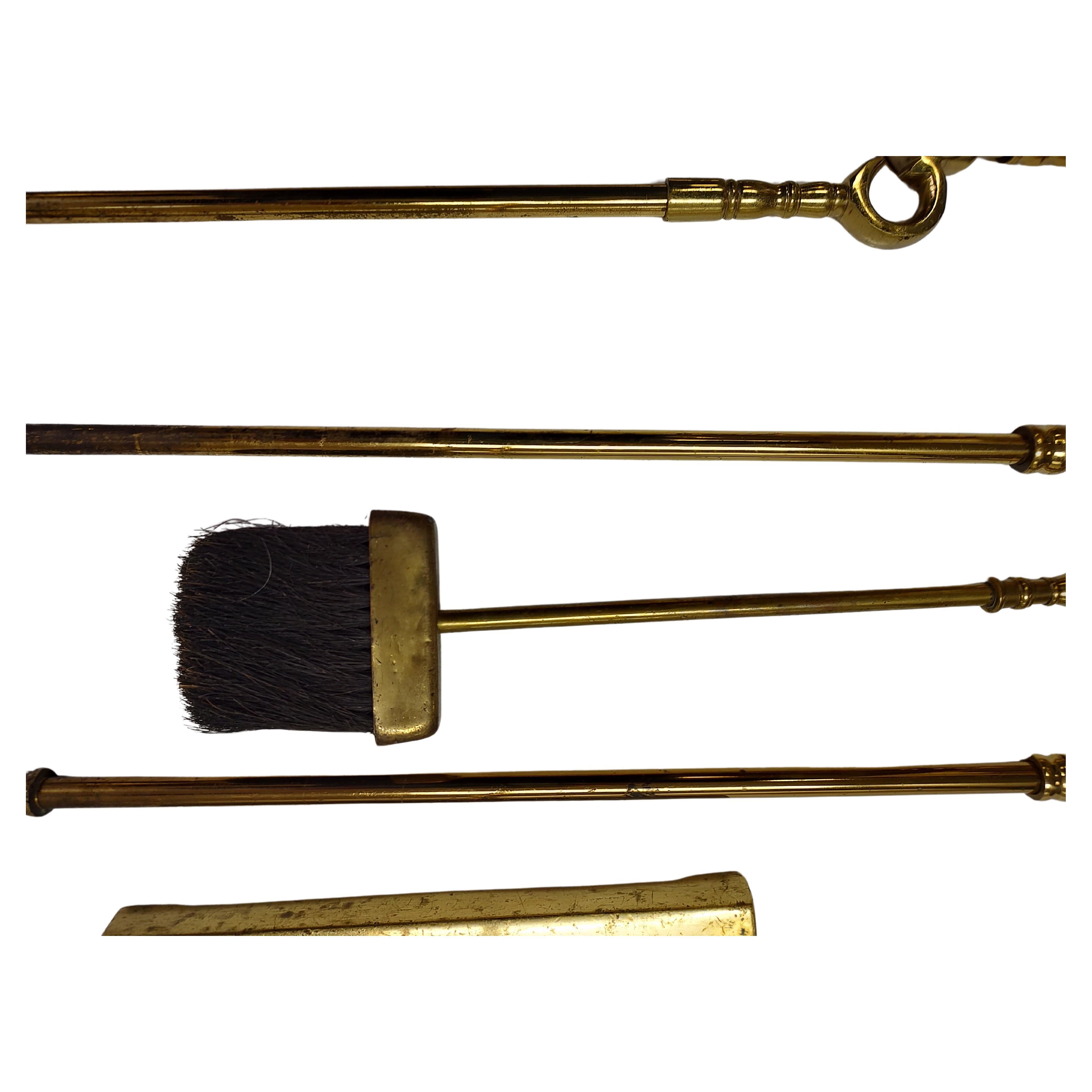 High quality set of fireplace tools with Holder. Brush, shovel, poker and log clamp all in solid brass. In excellent vintage condition with minimal wear. This item can be parcel posted.
