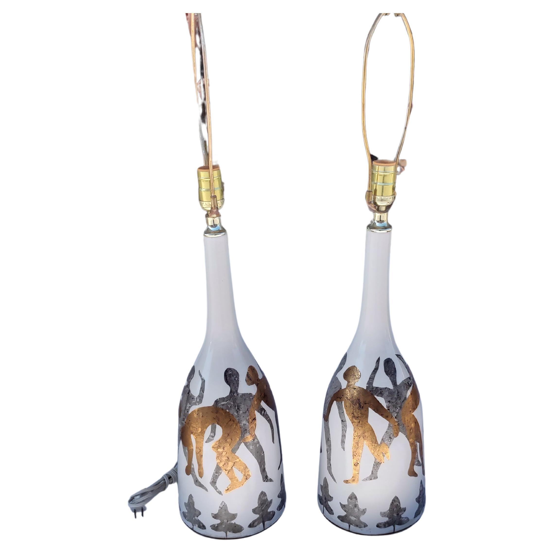 Hand-Crafted Pair of Mid-Century Modern Bottle Form Table Lamps with Gilt Figural Acrobats   For Sale
