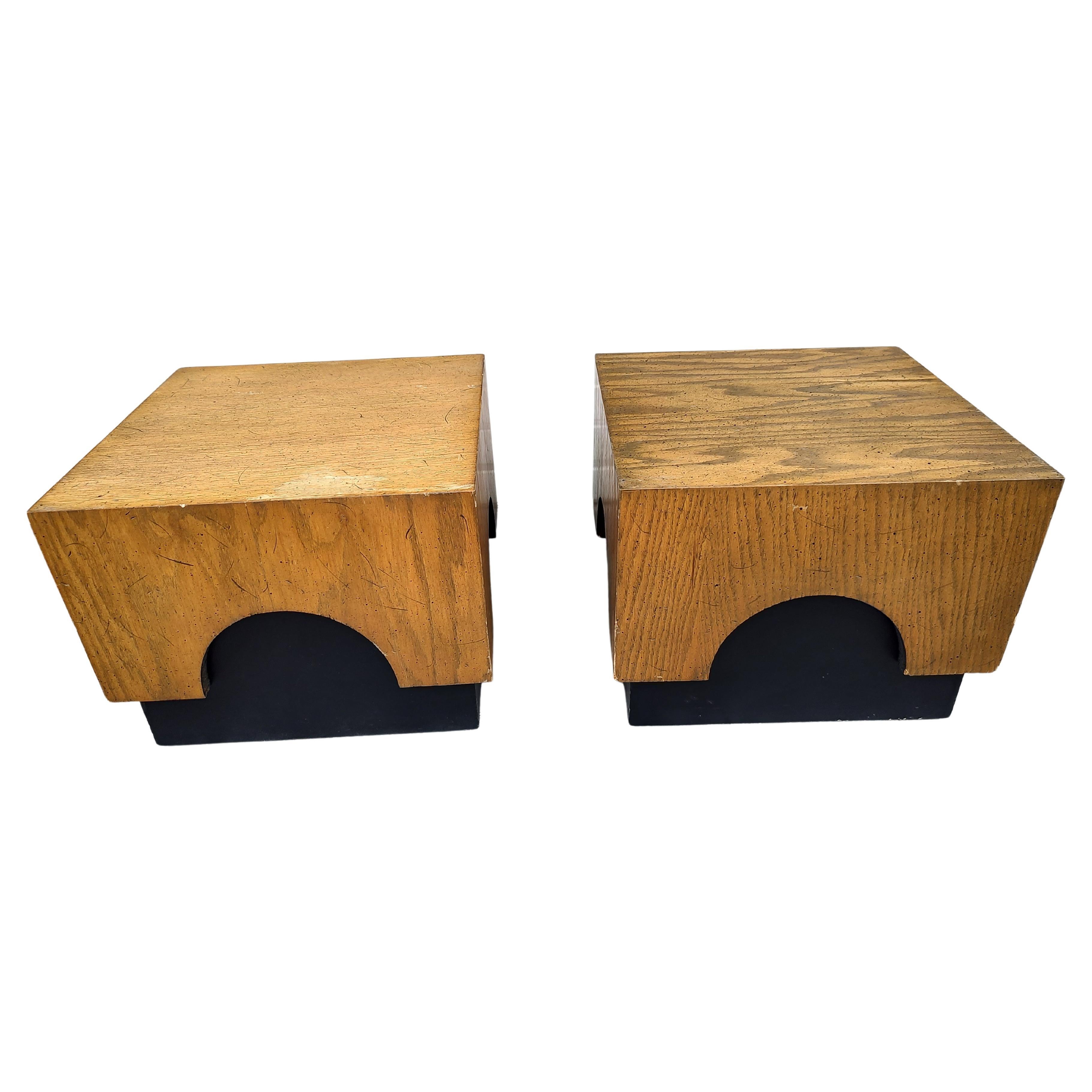 Unusual pair of low tables with oak and black bases with arches that are prominent. In excellent vintage condition with minimal wear. These came from an estate that had other Adrian Pearsall furniture. Can be parcel posted.