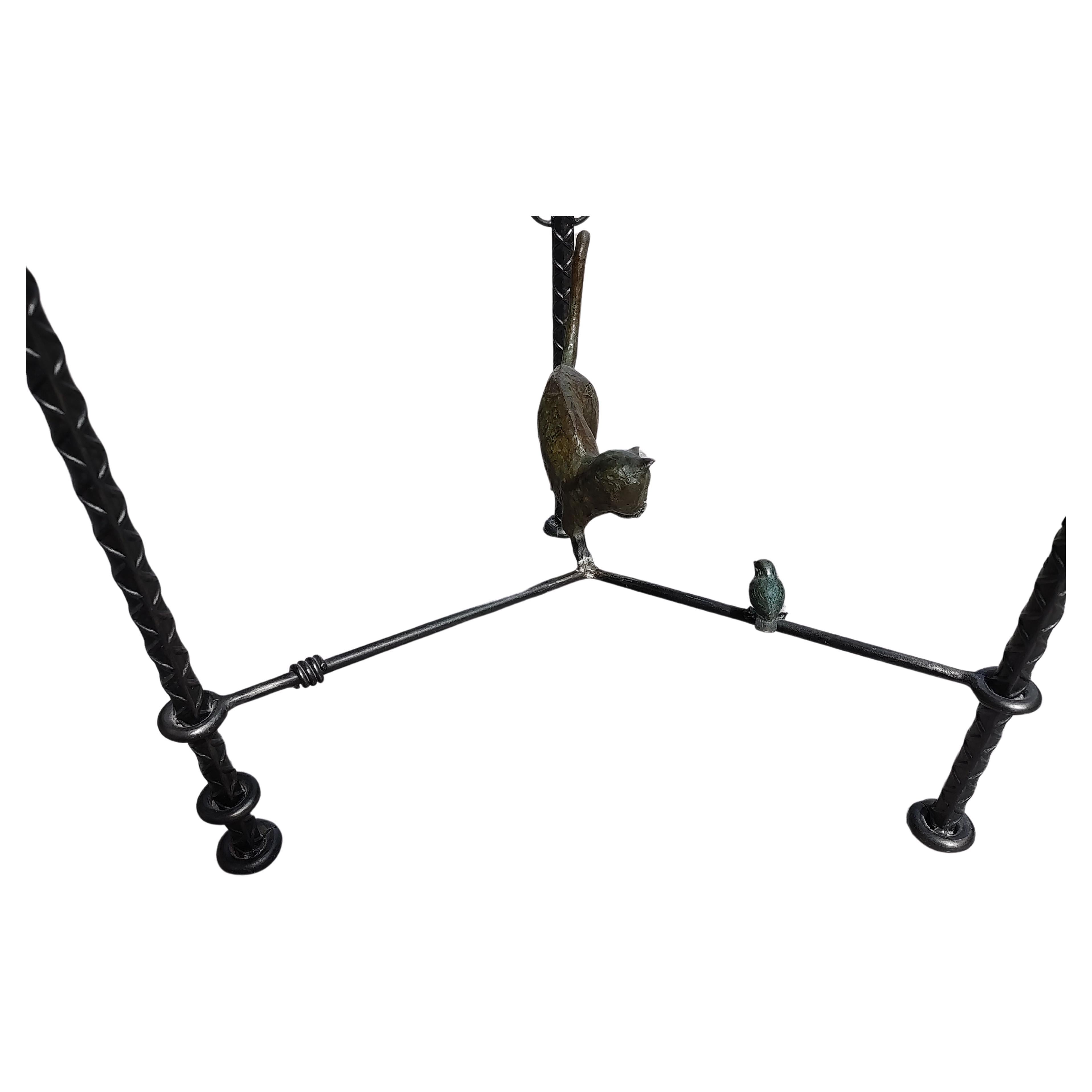 Fabulous cast bronze table by Ilana Goor an Israeli artist, with industrial rebar like legs in the style of Alberto & Diego Giacometti. A playful cat with a sparrow like bird sitting on the stretchers in Bronze. Signed and numbered, 39/100. In
