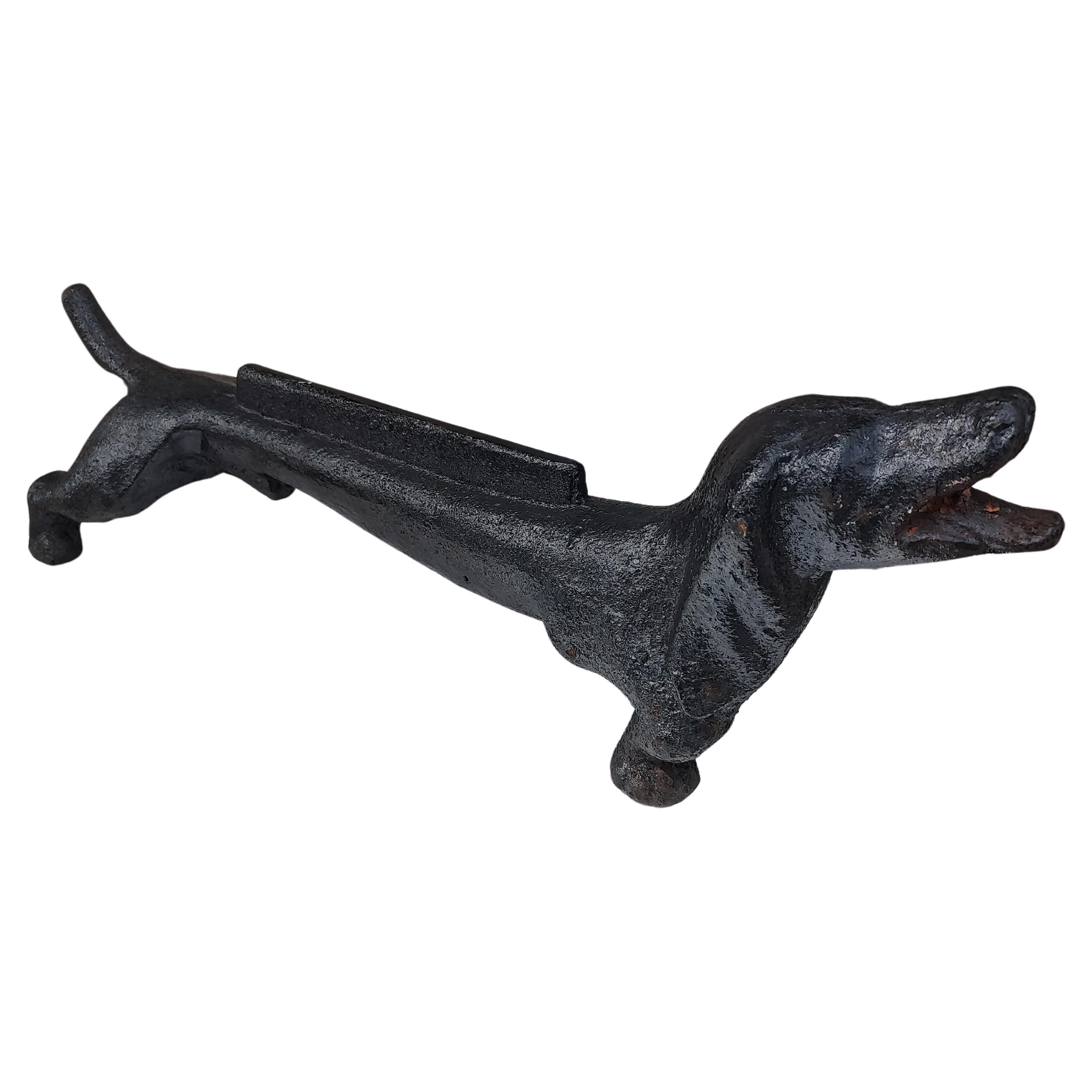 Fabulous cast iron dachshund dog boot scraper in black paint. Two available, this one has a straight tail as opposed to the other with a circle tail. Other minor differences. In excellent vintage condition with minimal wear. Can be parcel posted.
