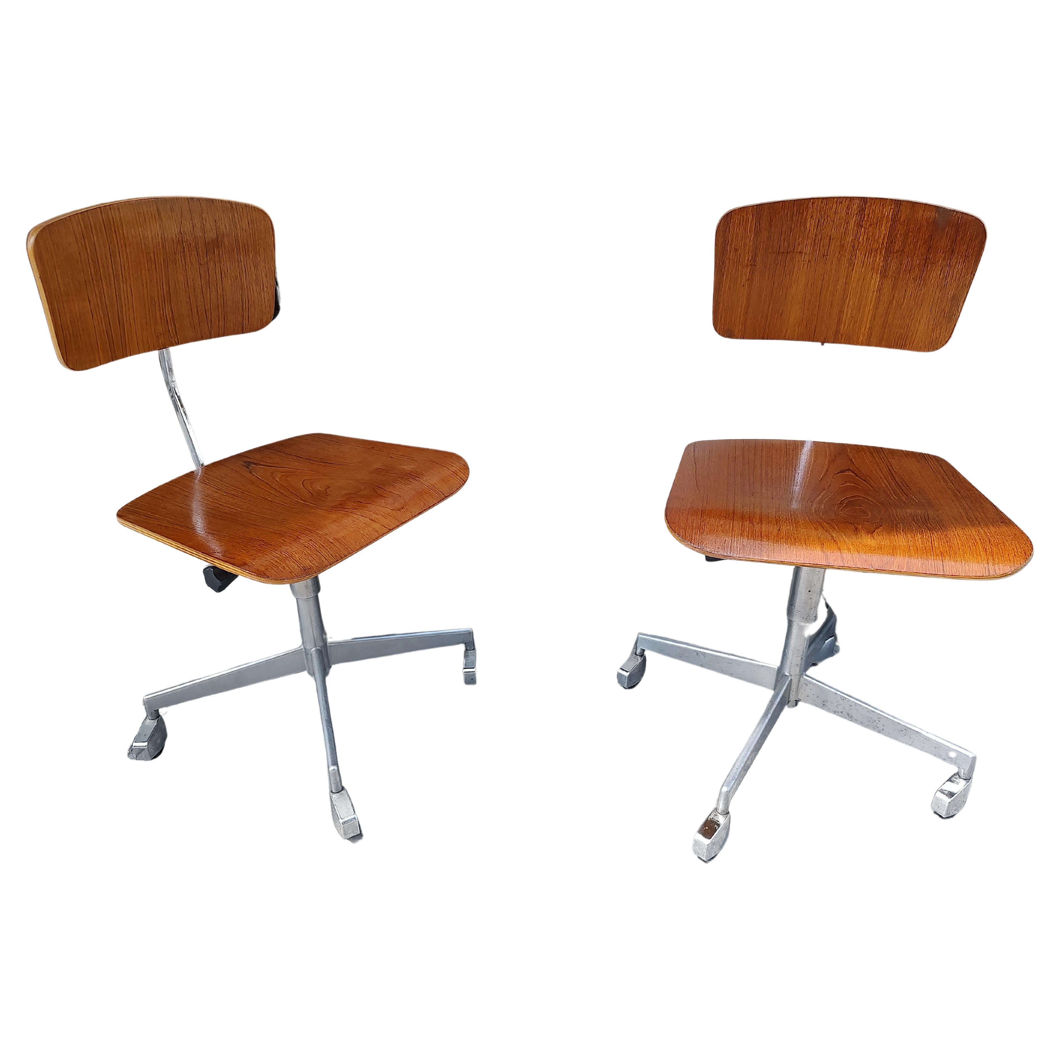 Fabulous pair of Mid-Century Modern sculptural Scandinavian walnut desk chairs by Jorgen Rasmussen for Labofa, c1955. Bent walnut plywood in original finish and in excellent vintage condition with minimal wear. Seat and back adjust in height to fit