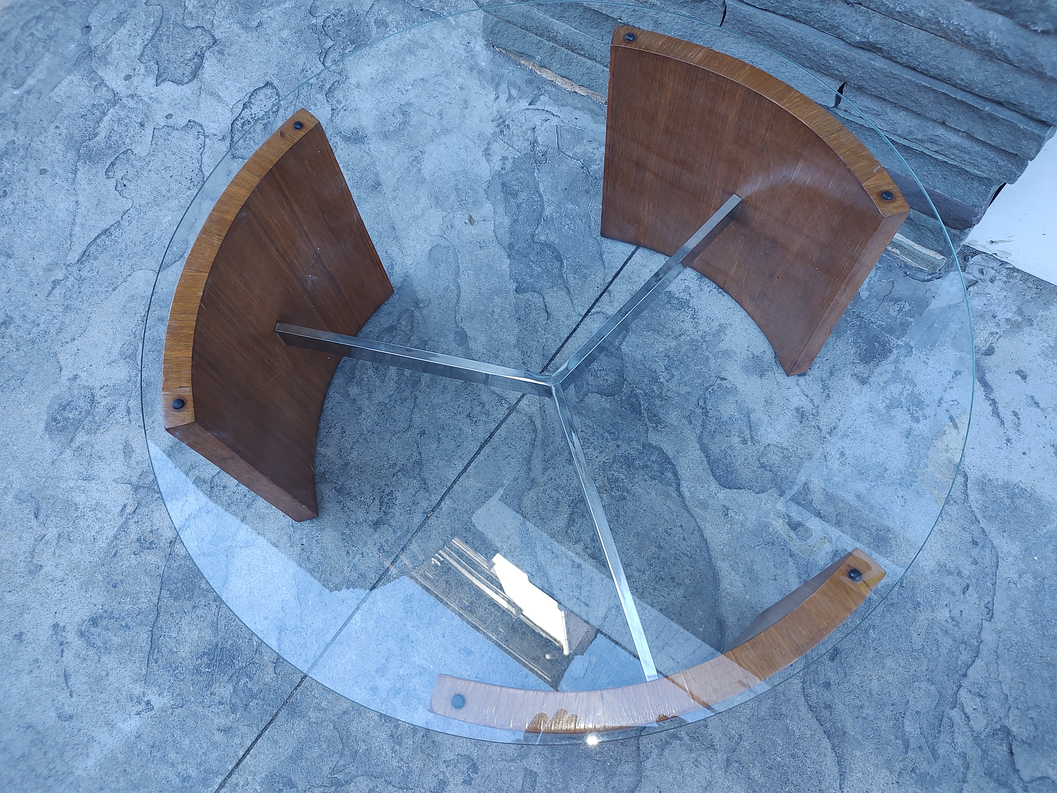Fabulous Radius cocktail table by Vladimir Kagan. Three sided curved walnut slabs connected by a chromed steel spoke. Glass top is 30