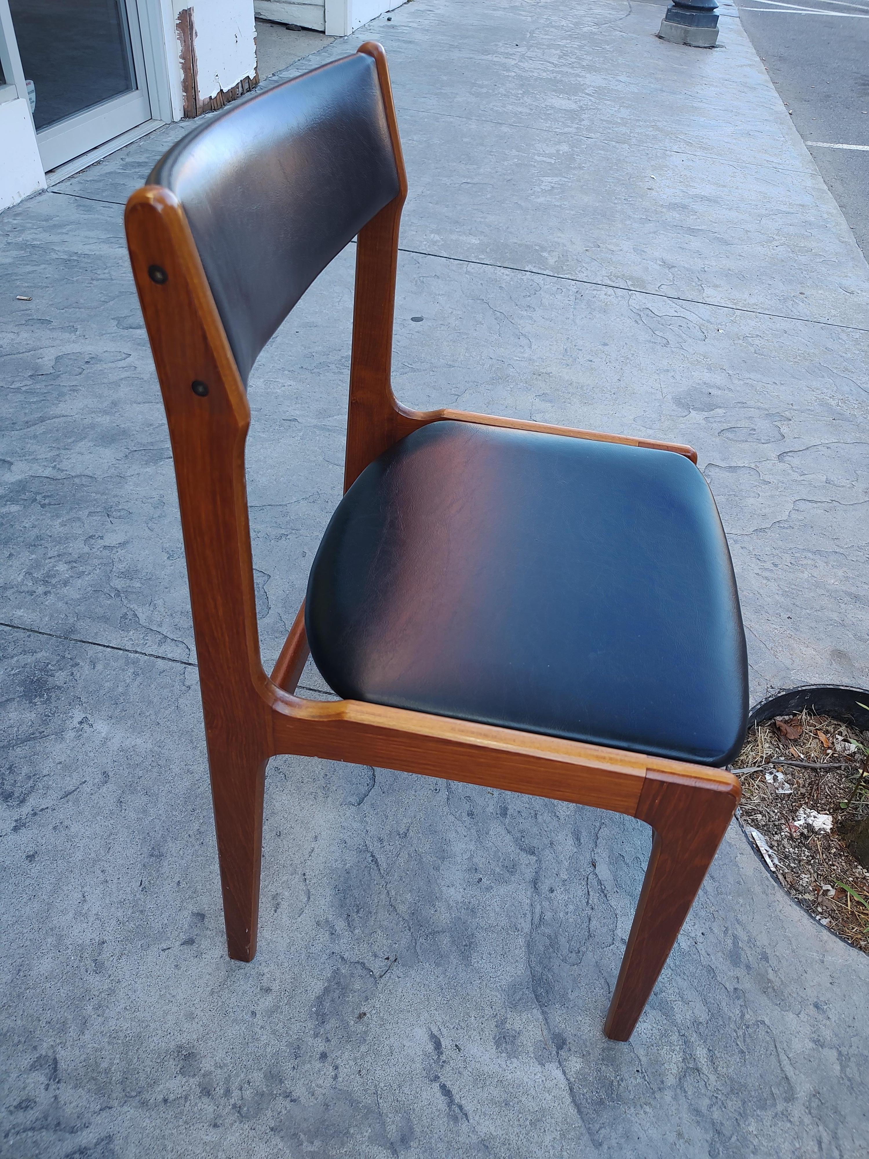 Fabulous set of 10 teak dining chairs with Leather seats and backs by Erik Buch. All in excellent vintage condition with minimal wear. Ship lap construction at the joints for optimum durability. Very comfortable. In excellent vintage condition with