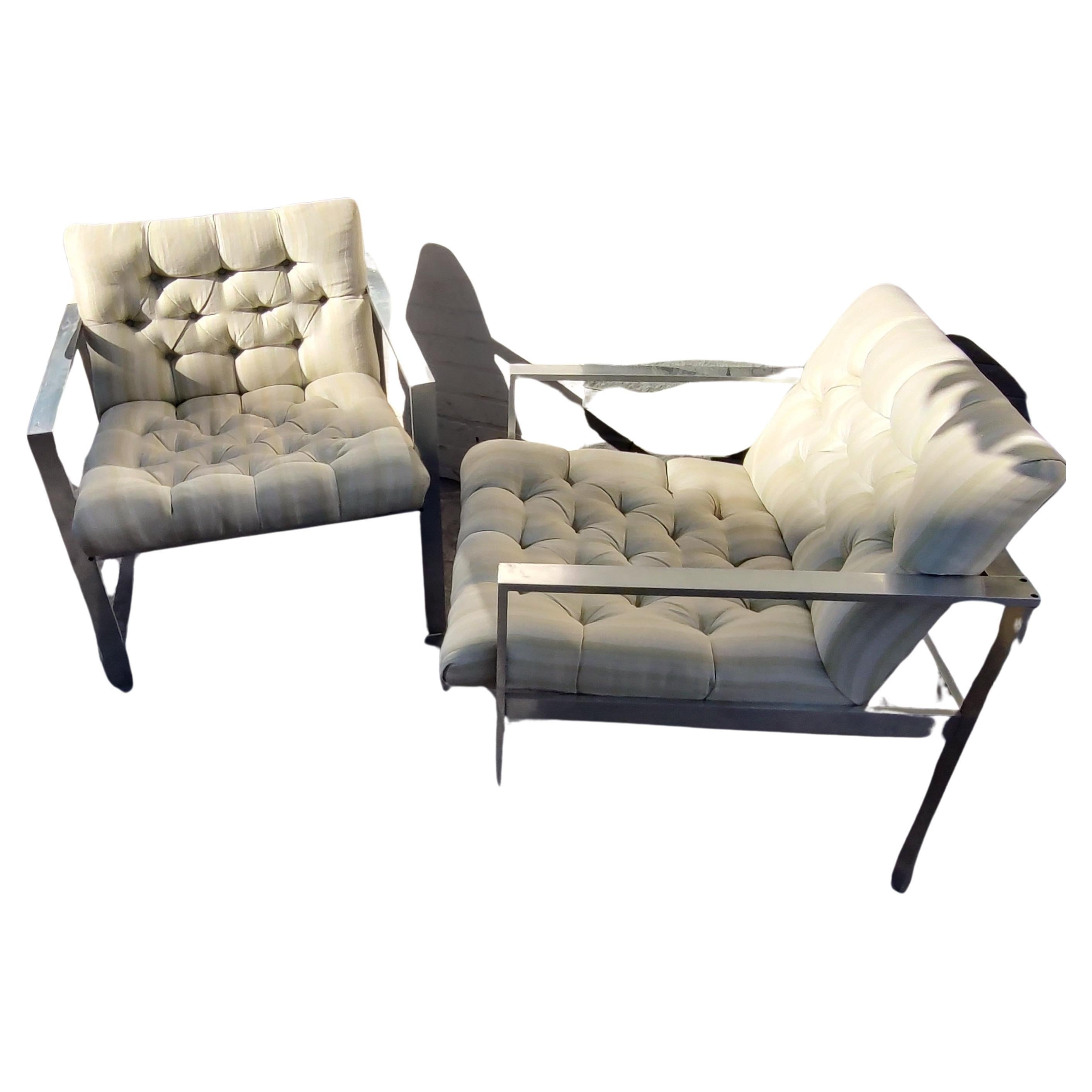 Simple and elegant pair of Mid-Century Modern Sculptural tufted lounge chairs by Harvey Probber. Alcoa aluminum is the main material making up the beautiful frames. Button tufted with a nice striped material. In excellent vintage condition, minor