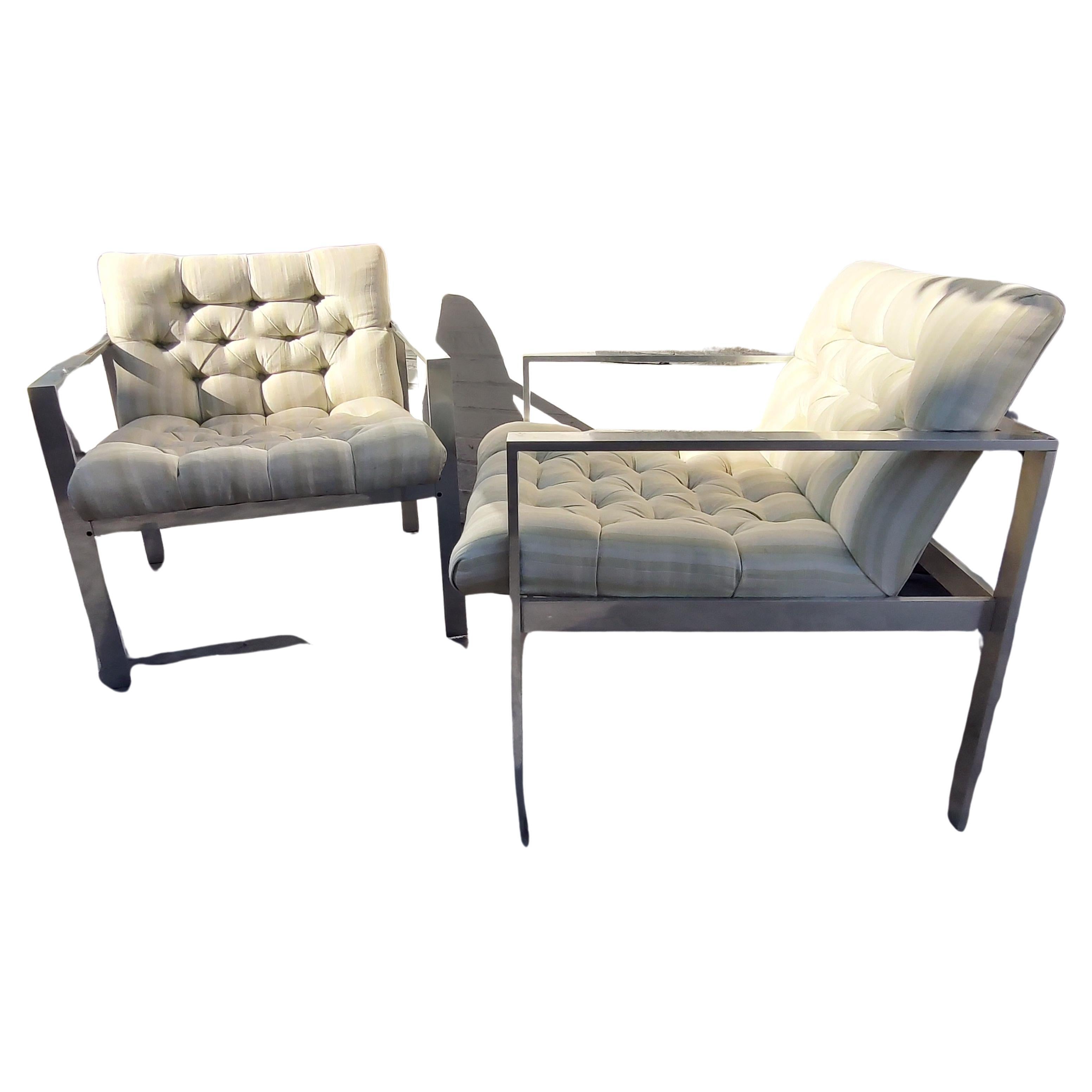 Simple and elegant pair of Mid-Century Modern Sculptural tufted lounge chairs by Harvey Probber. Alcoa aluminum is the main material making up the beautiful frames. Button tufted with a nice striped material. In excellent vintage condition, minor