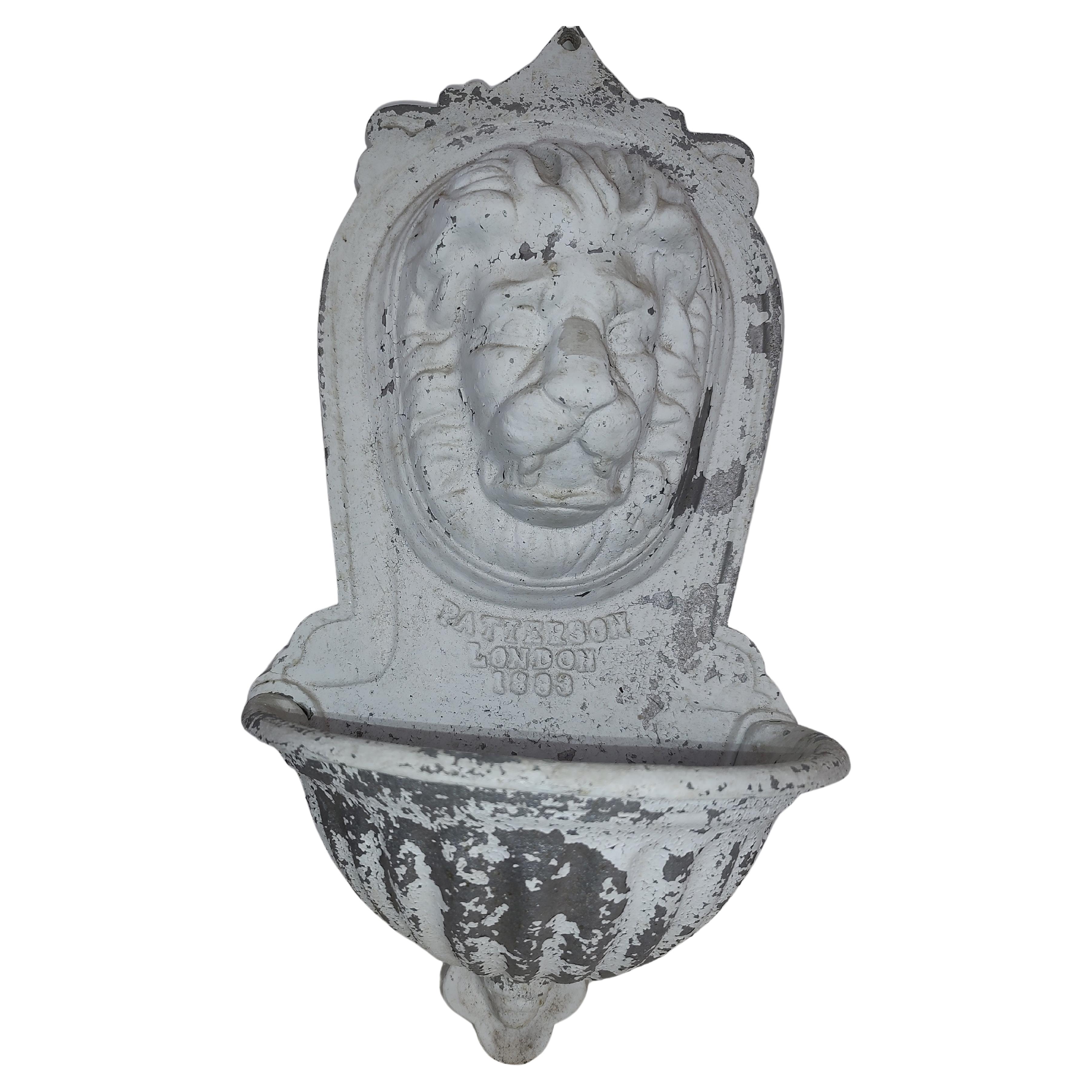 Fabulous wall fountain or planter in aluminum. Cast lions Head and Patterson London 1893. Lots of patina on this one, peeling white paint. In excellent vintage condition with minimal wear. Can be parcel posted.