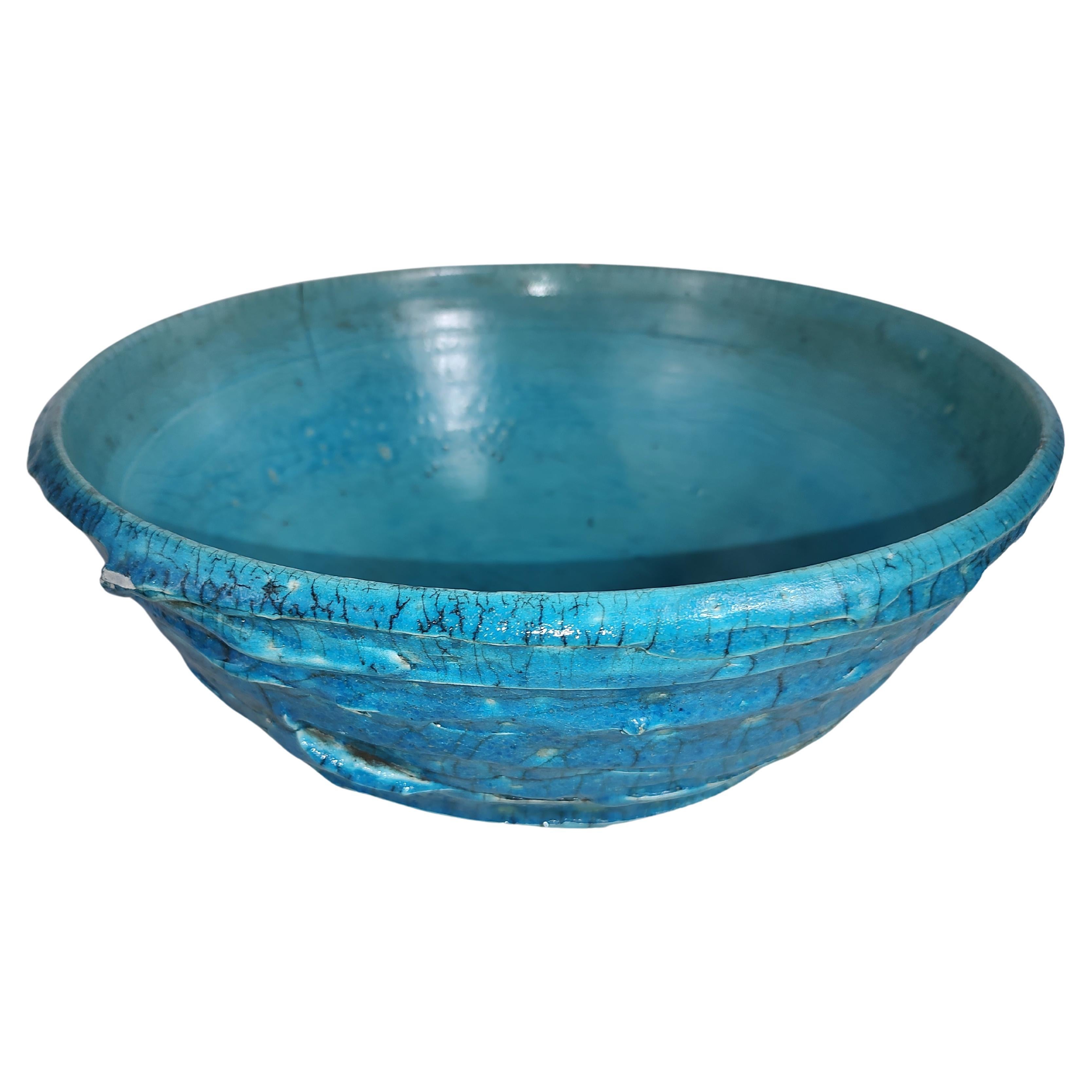 Fantastic colors of blue with a fabulous texture. This large bowl is a beauty and can function for more than just decoration's. In excellent vintage condition with minimal wear. Crackle is part of the design, still rings true when sounded. Can be
