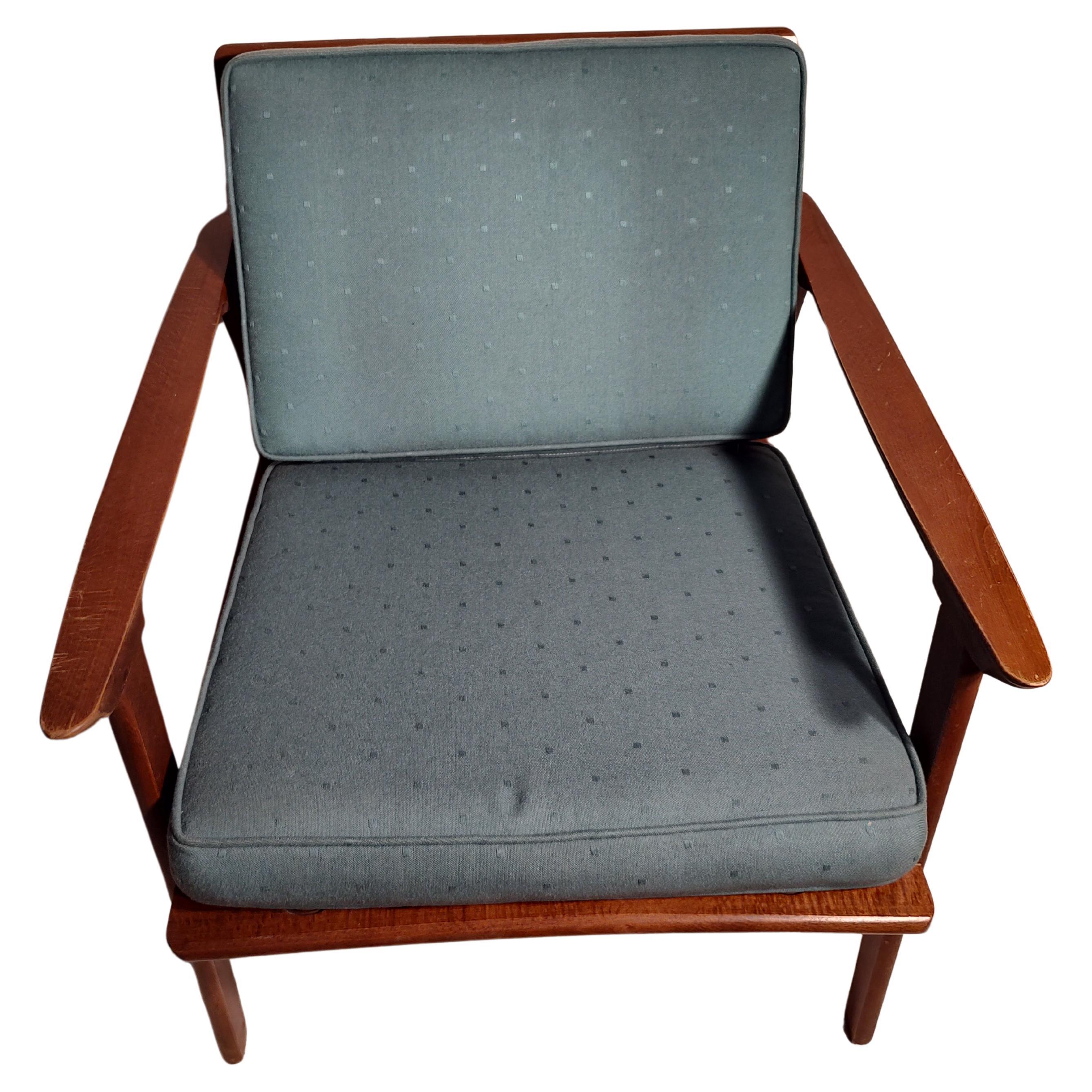 Fabulous Mid century modern pair of chairs, armchair rocker and a armchair. In very good original condition. Straps to hold cushions in place are tight and very strong. Minor normal wear to wood, reglued in spots where they had loosened.
Cushions