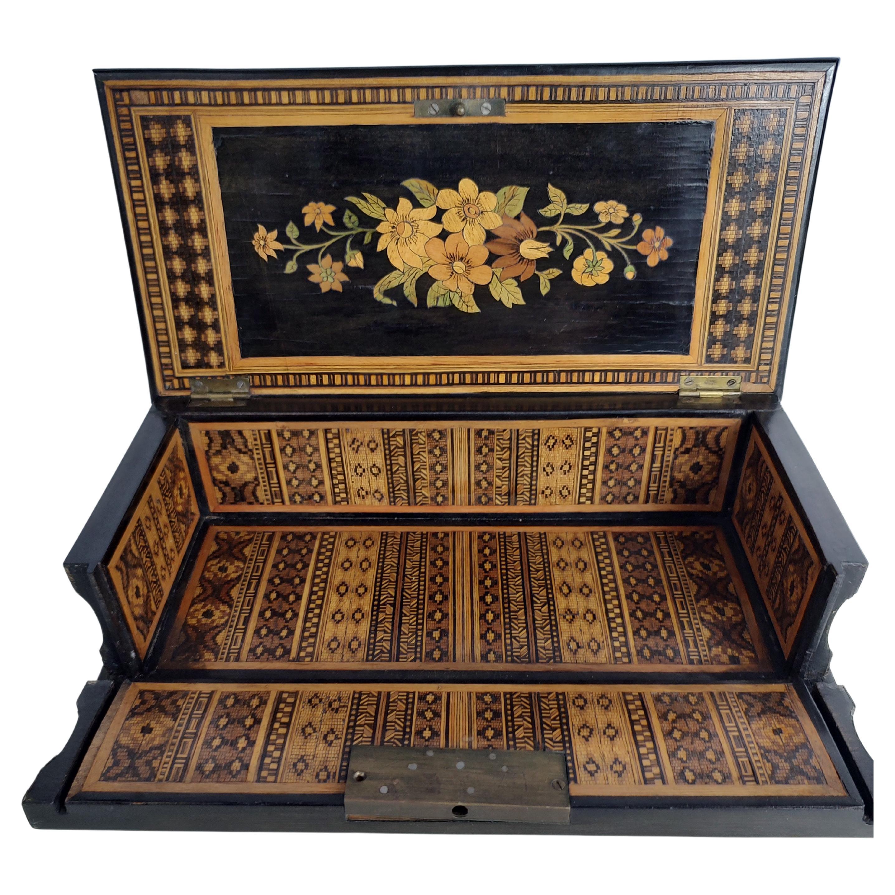 Amazing Marquetry and inlay on this Sorrento Napoli Box C1880. There is craftsmanship of the highest caliber all over this box. Box front drops down to reveal inside completely covered with tiny inlay. Top exterior has a pasta making scene with
