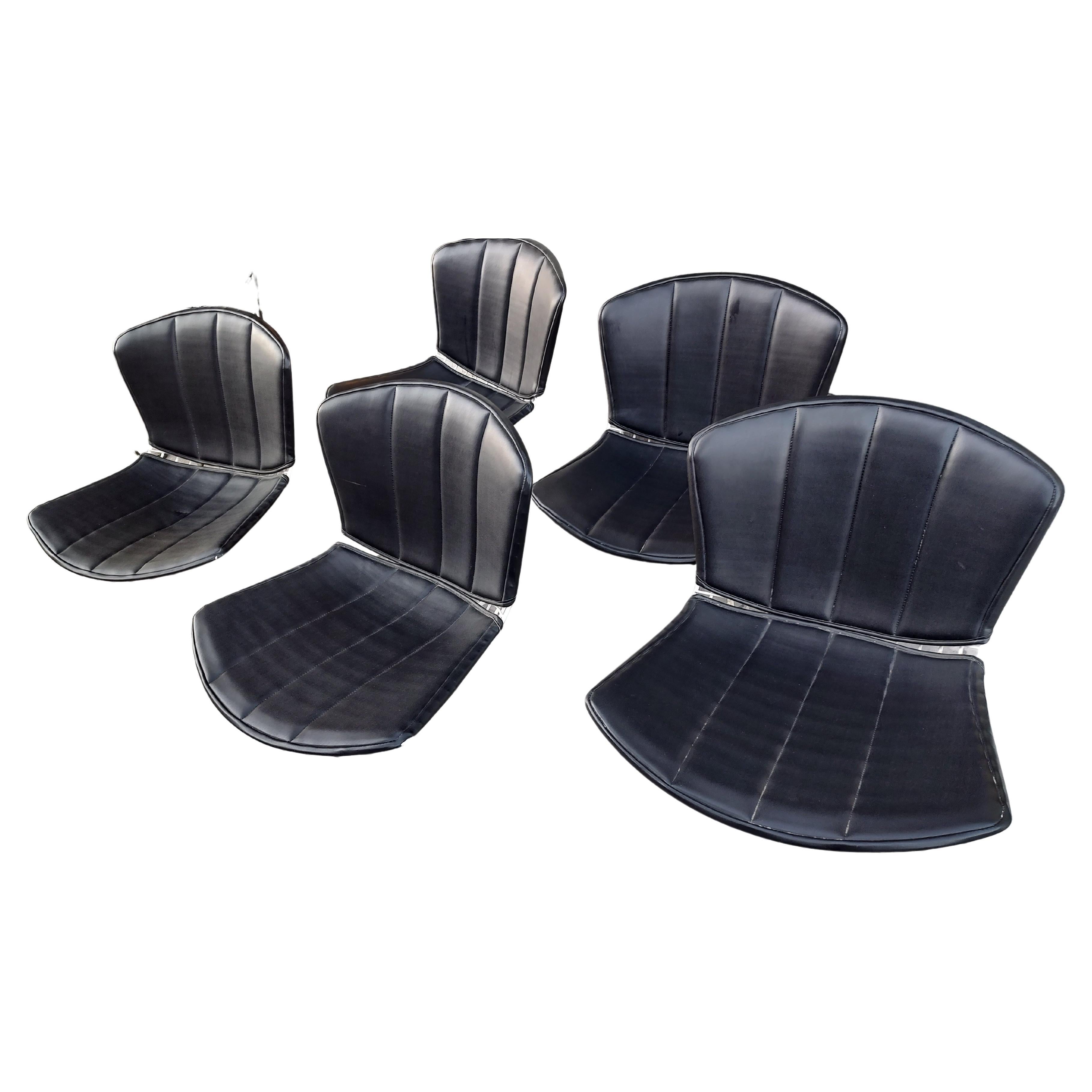Timeless and fabulous design by Harry Bertoia for Knoll International. Set of 3 classic beauties with full leather pads for seats and backs. All labeled and in very good condition with minimal wear. Some wear to corners of the leather but at a