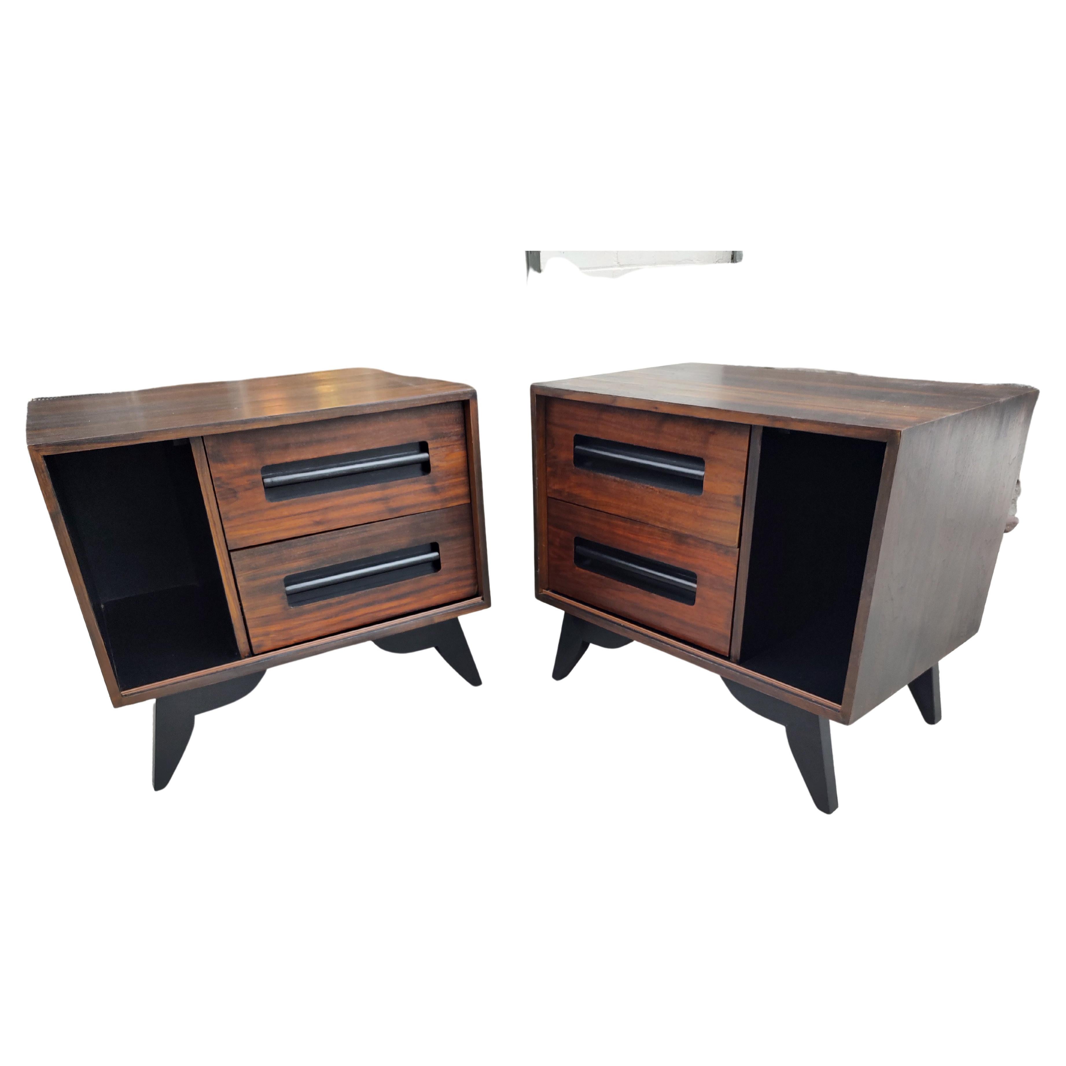 Fabulous pair of Mid-Century Modern Sculptural Scandinavian Rosewood and Black Lacquer nightstands. Two drawers & a opening for having a space at the ready. In excellent vintage condition with minimal wear. These were refinished not long ago. Sold