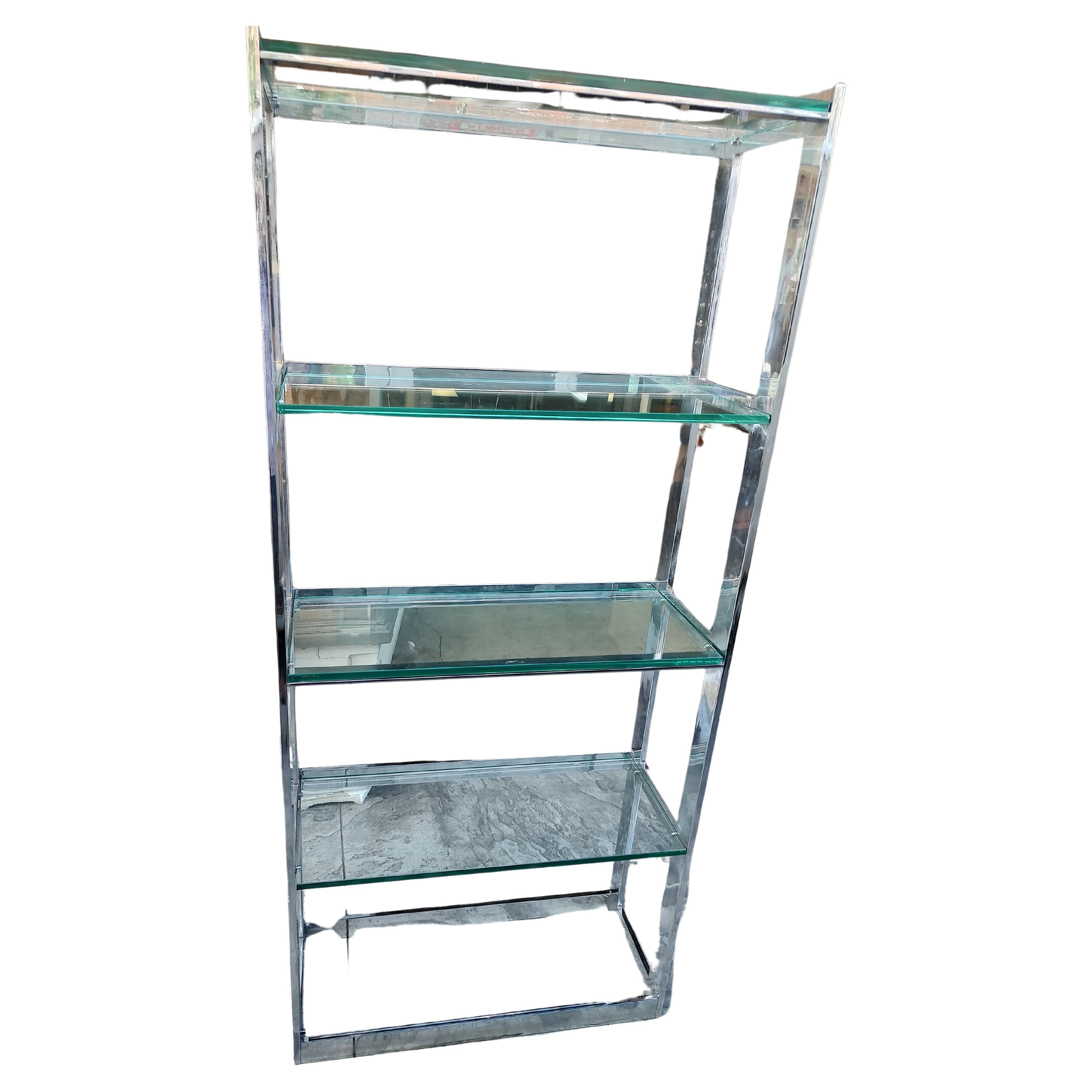 Pair of Mid-Century Modern flat bar chrome Etageres with 1/2 inch thick glass shelving. In excellent vintage condition with small chips to the glass corners. 5 glass shelves. Chrome will be polished at sale time. Quality piece. Very tight.