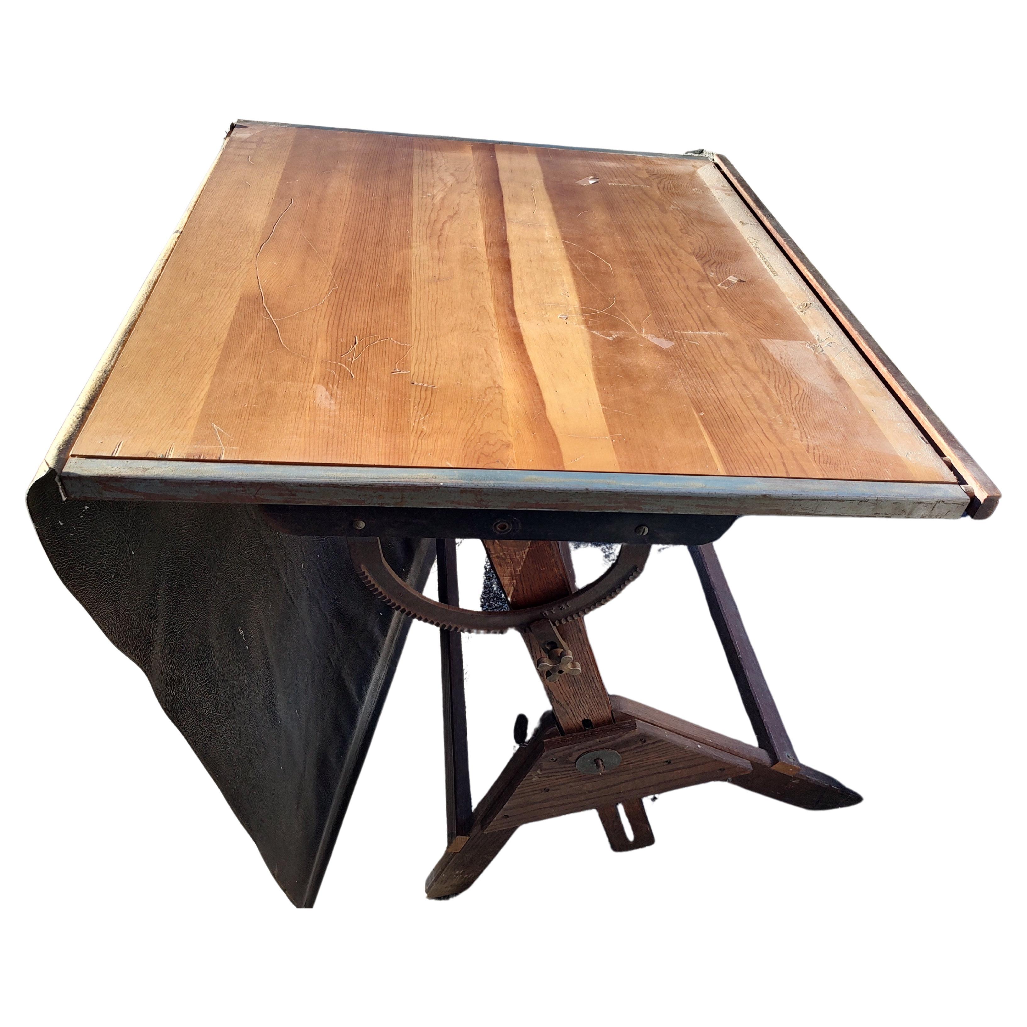 Great size and construction using oak for the base and maple for the top. Iron adjustment hardware all in very good condition with age related wear. No abuse. Height reaches 44inches and is fully adjustable to all angles. Has the original vinyl