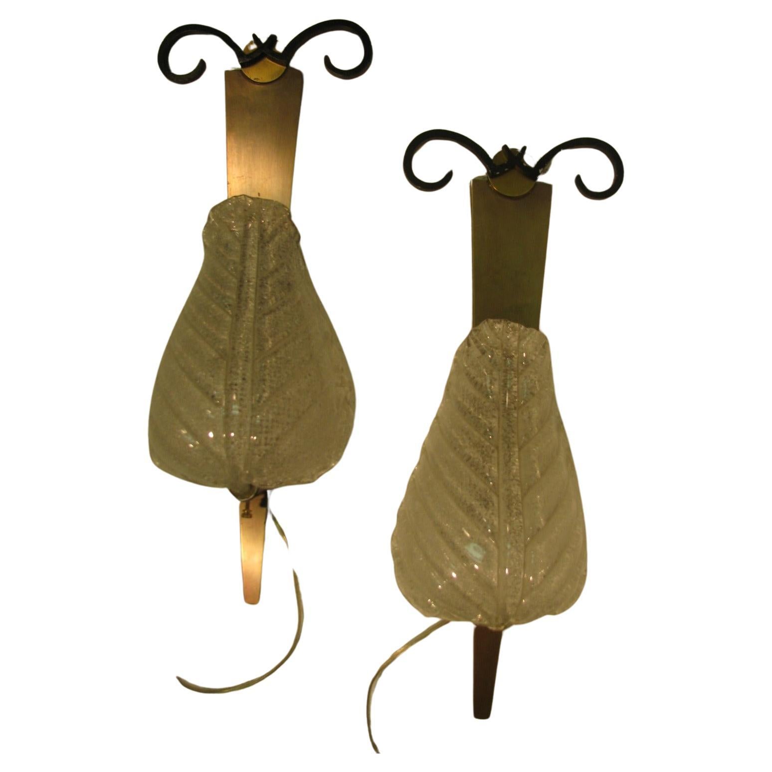 Pair of Barovier e Toso glass leaf wall sconces. Beautifully formed glass wraps around the light source. Brass with painted steel back plates. Newly rewired. This item can be parcel posted. In excellent vintage condition with minimal wear.