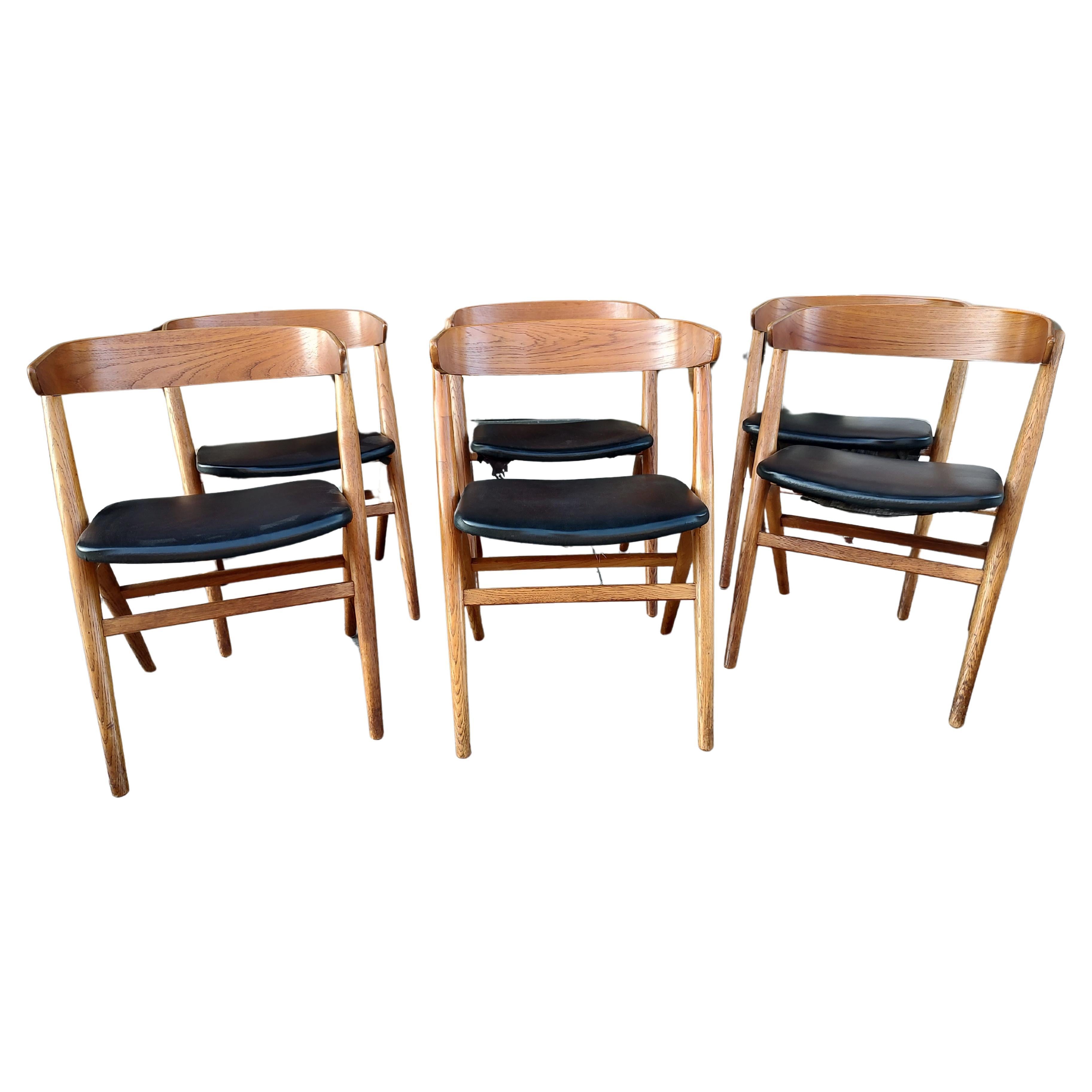Fabulous set of six dining chairs by Helge Sibast with curved, molded backrests and a A - Frame style base for design of the chair. Faux leather Skai is the material on the seats. In excellent vintage condition with minimal wear. One chair has had a