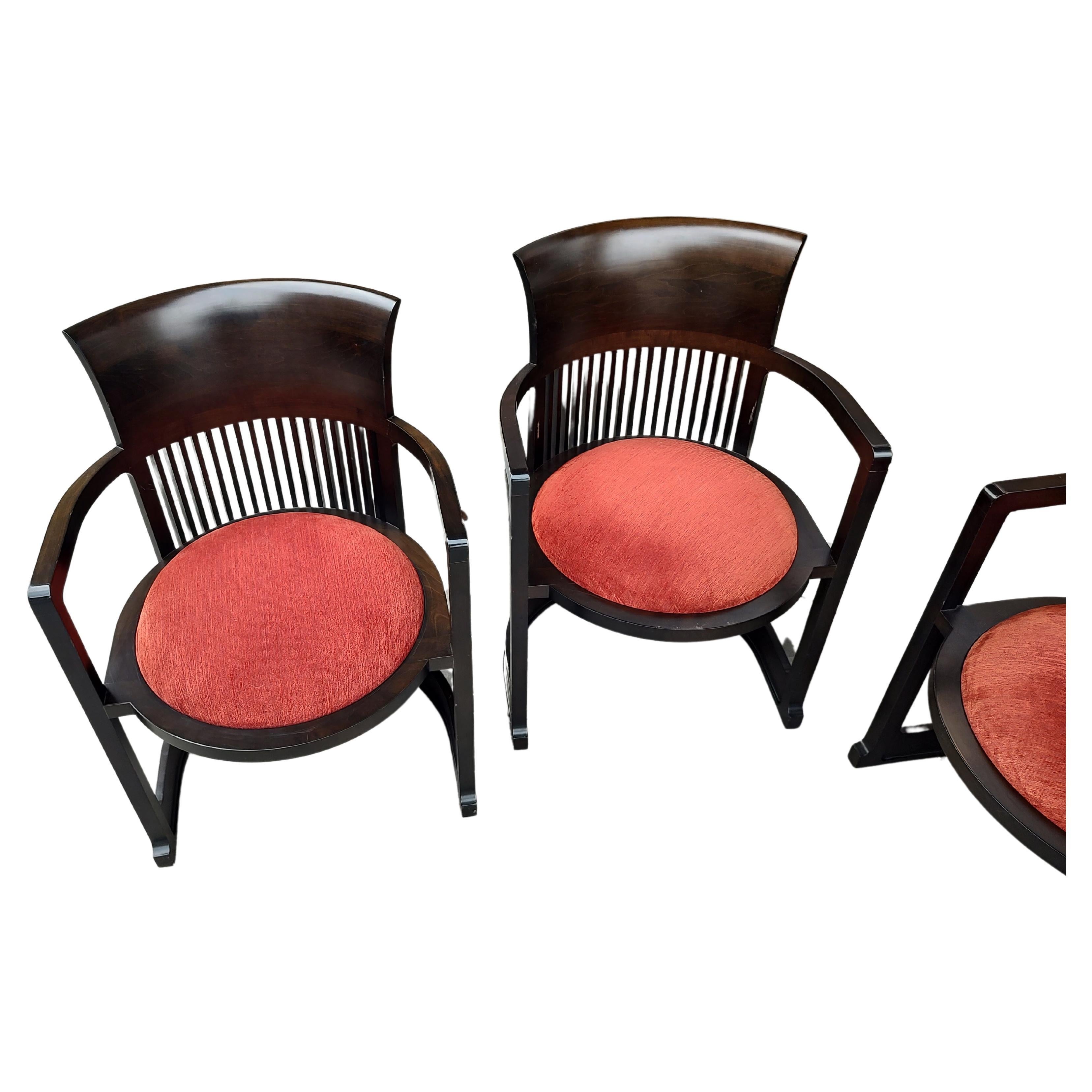 Spectacular set of 4 barrel back chairs designed by Frank Lloyd Wright in 1906-07 and produced in 1936. This is a 1986 collaboration by Cassina of Italy and the Frank Lloyd Wright Foundation. Amazing craftsmanship and design. Chairs are in excellent