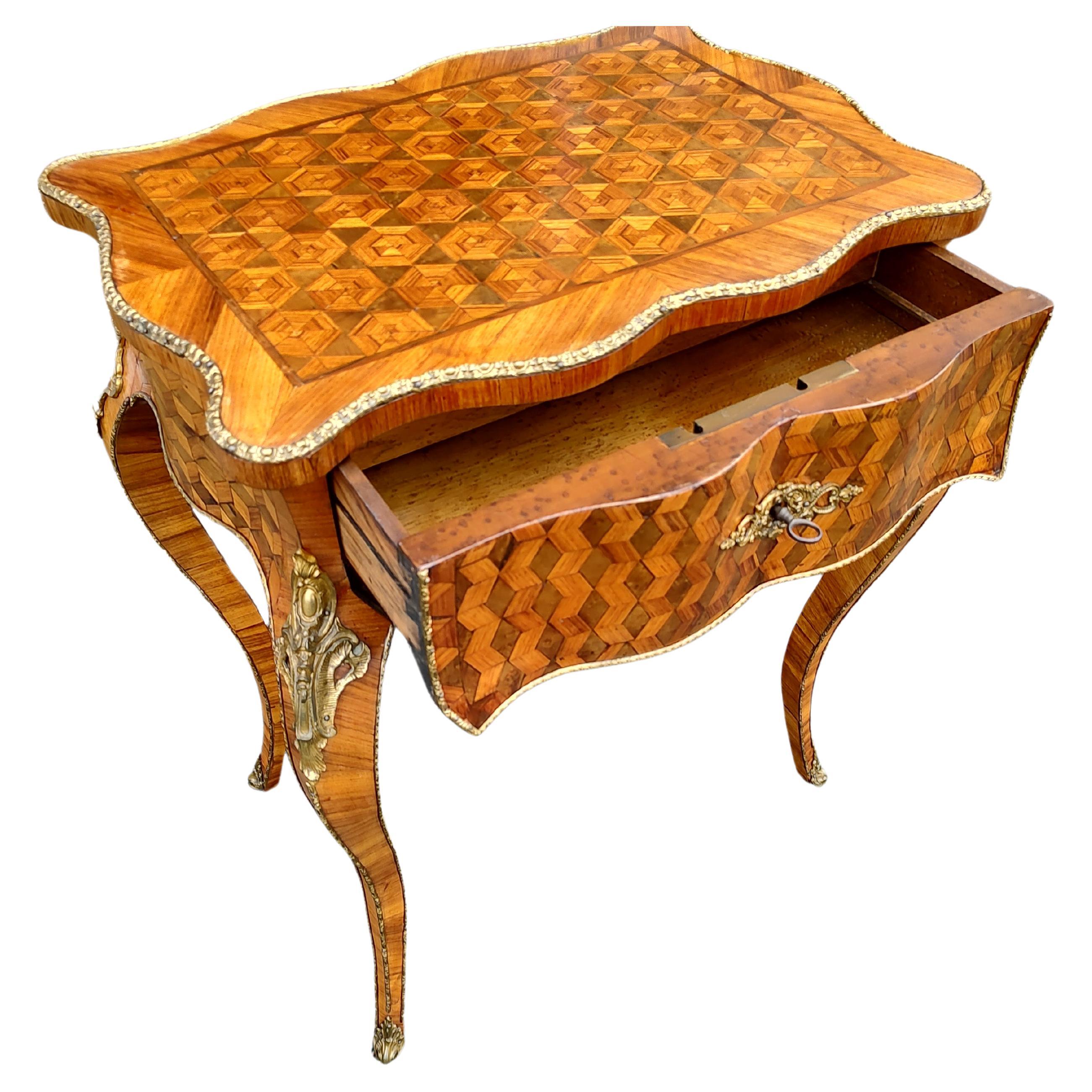 Fabulous French vanity with a flip lid top which opens to reveal a divided tray atop a drawer. Great craftsmanship in the Marquetry with cross banding. Bronze castings crisp and sharp. Cabriole legs support the cabinet. All in excellent vintage