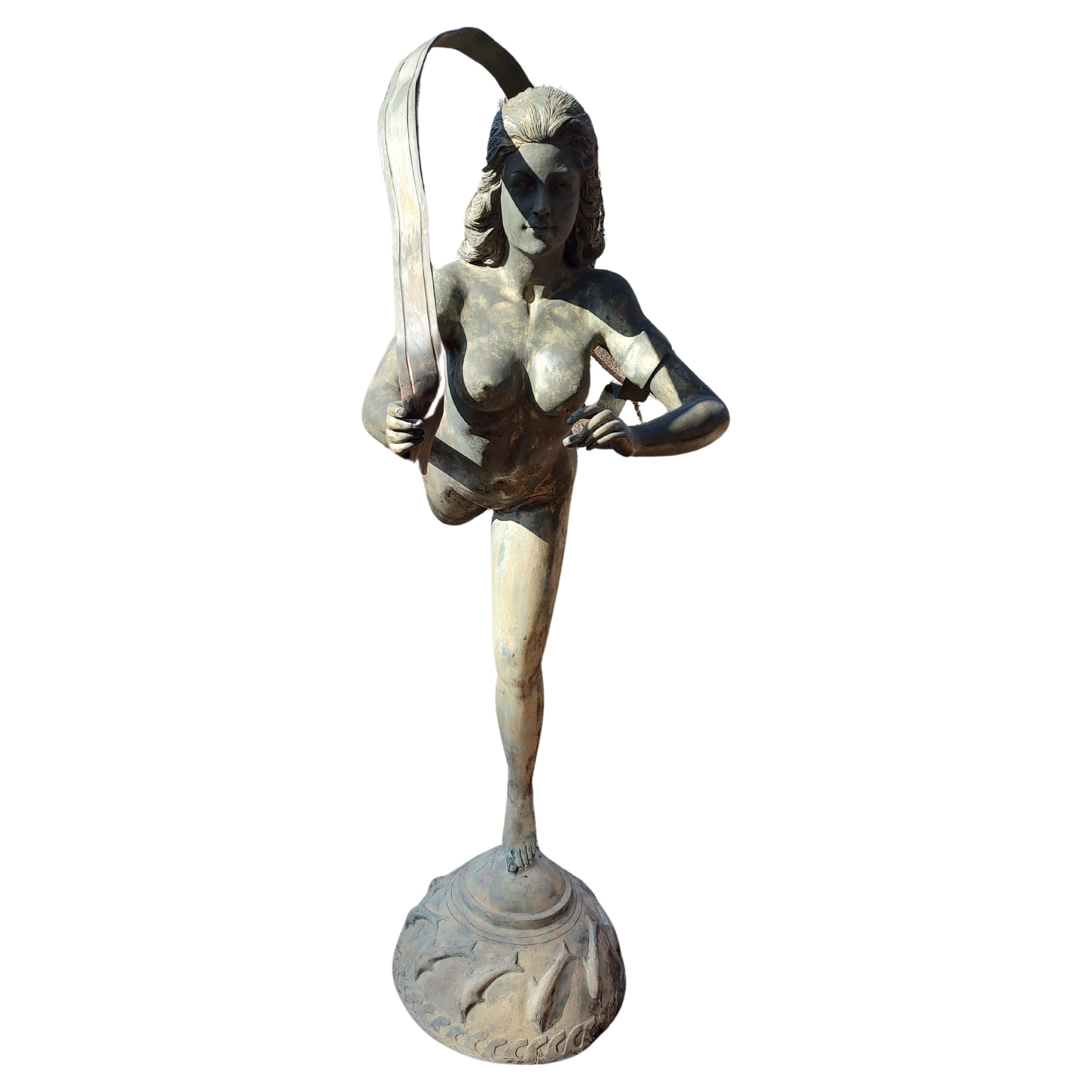 Fabulous and elegant bronze figure of a nude woman gliding, dancing forward. In the style of Messenger of the Gods. Tall 6 ft 3inches by 68 wide will enhance your garden greatly. Floating thru with nothing but a veil, a statement piece for sure. In