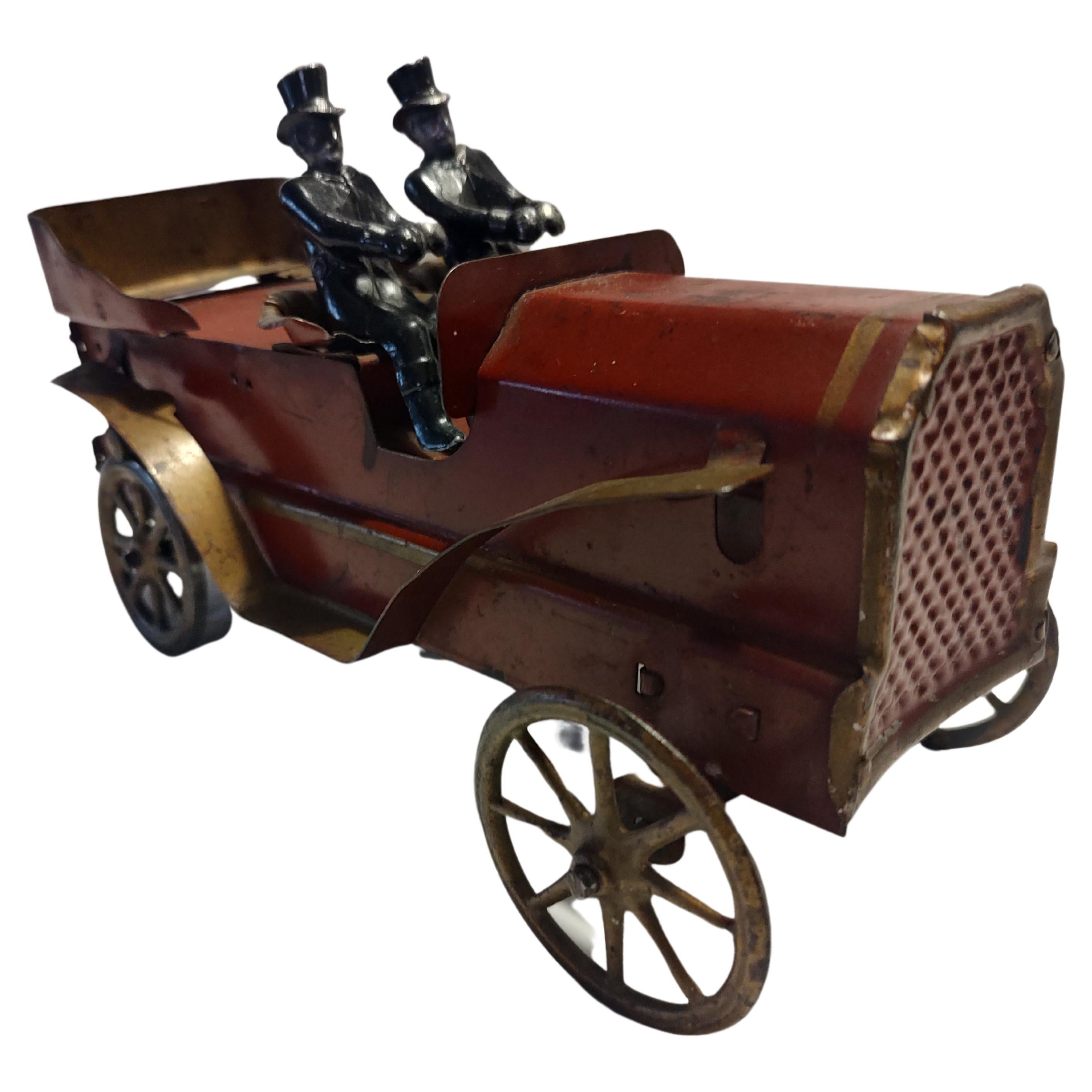 Fabulous example of a dayton hill climber open touring car from the early part of the 20th century.
In excellent antique condition with age appropriate wear. Two cast iron figures included. Still functions well as a hill climber.