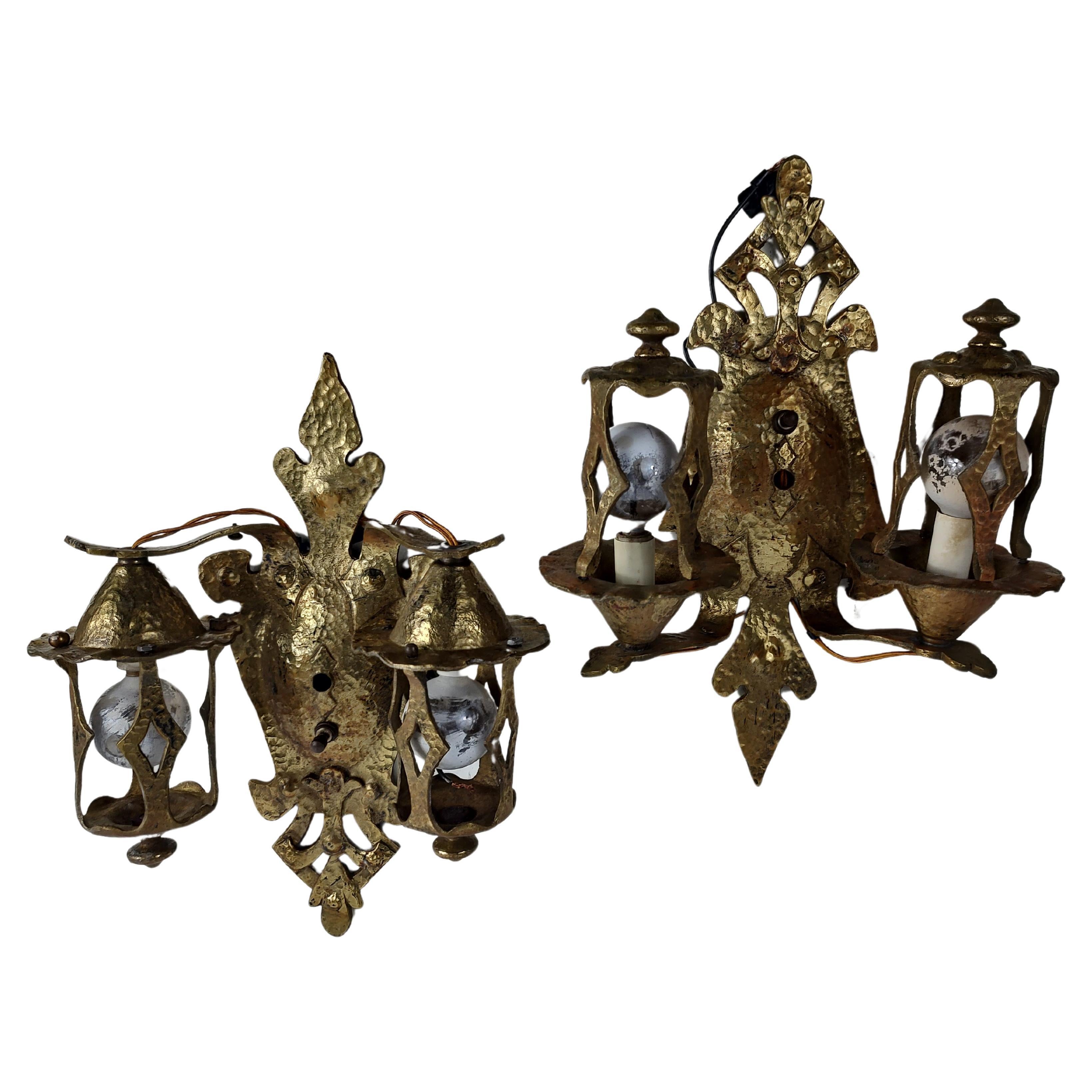 Fabulous pair of solid brass Arts & Crafts hand-hammered wall sconces with all new wiring and electrical components. Truly a great looking design with 2 bulbs on each sconce. Original locking nuts and hardware not pictured also included. In