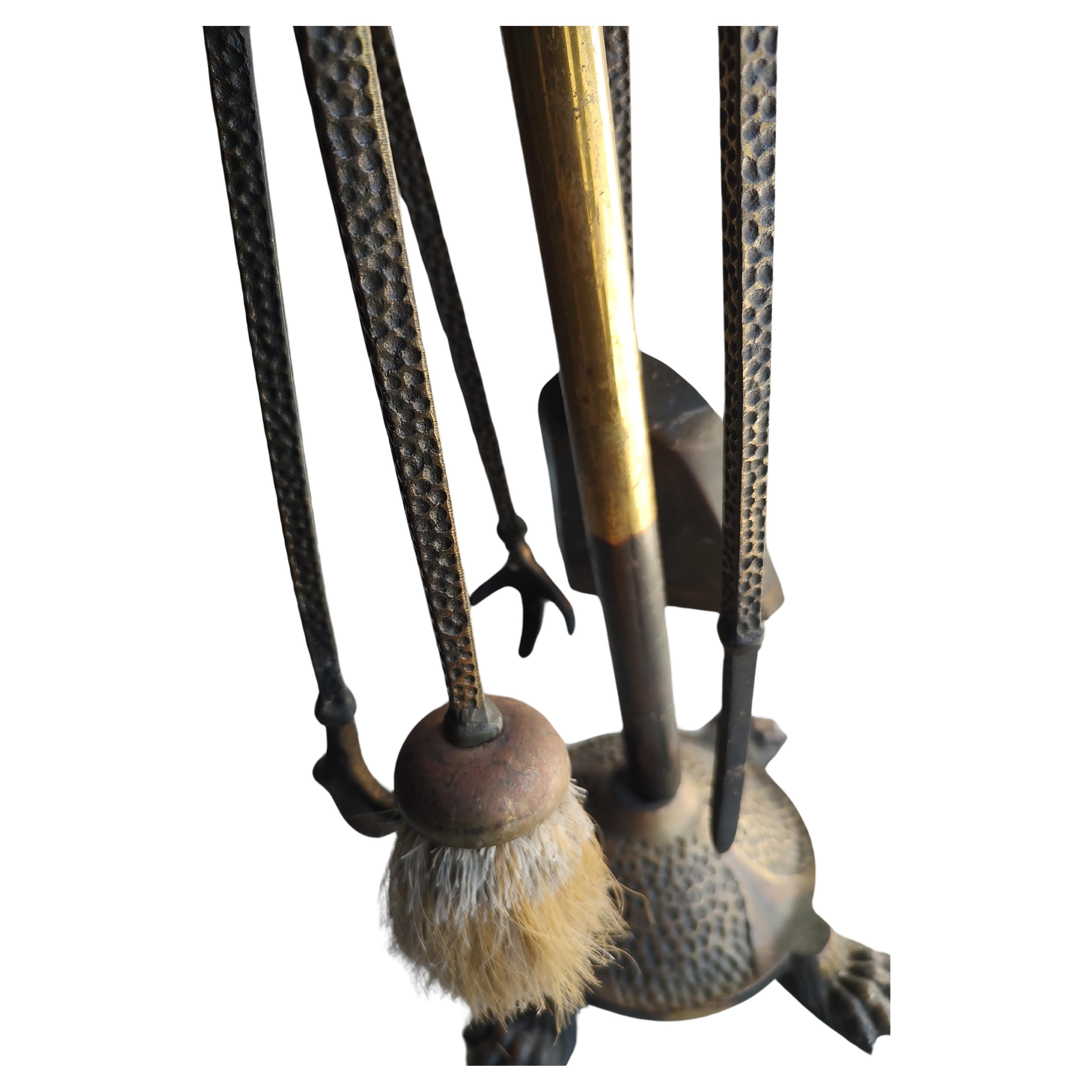 Fabulous set of 4 tools with the holder. Hammered brass with claw feet and duck heads atop each tool & the holder. Shovel, brush, poker and the tongs with the holder all in excellent antique condition with no issues.