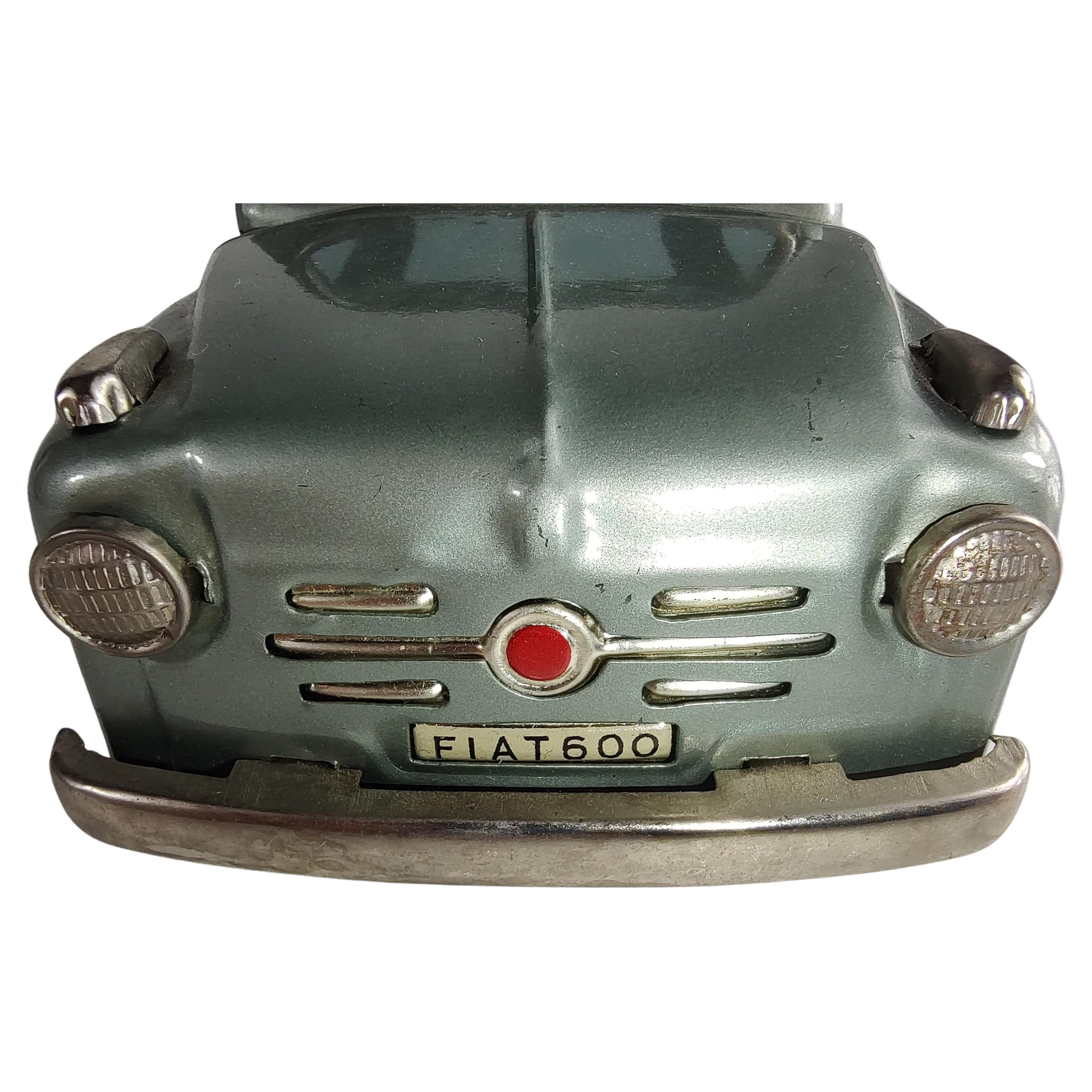 Fabulous and in near mint condition Fiat 600 with a rollback cloth convertible top. From a lot of seventeen that were probably stored from day one, and never played with. Made by Bandai I believe it's a 1958 model. Friction works great. Top rolls