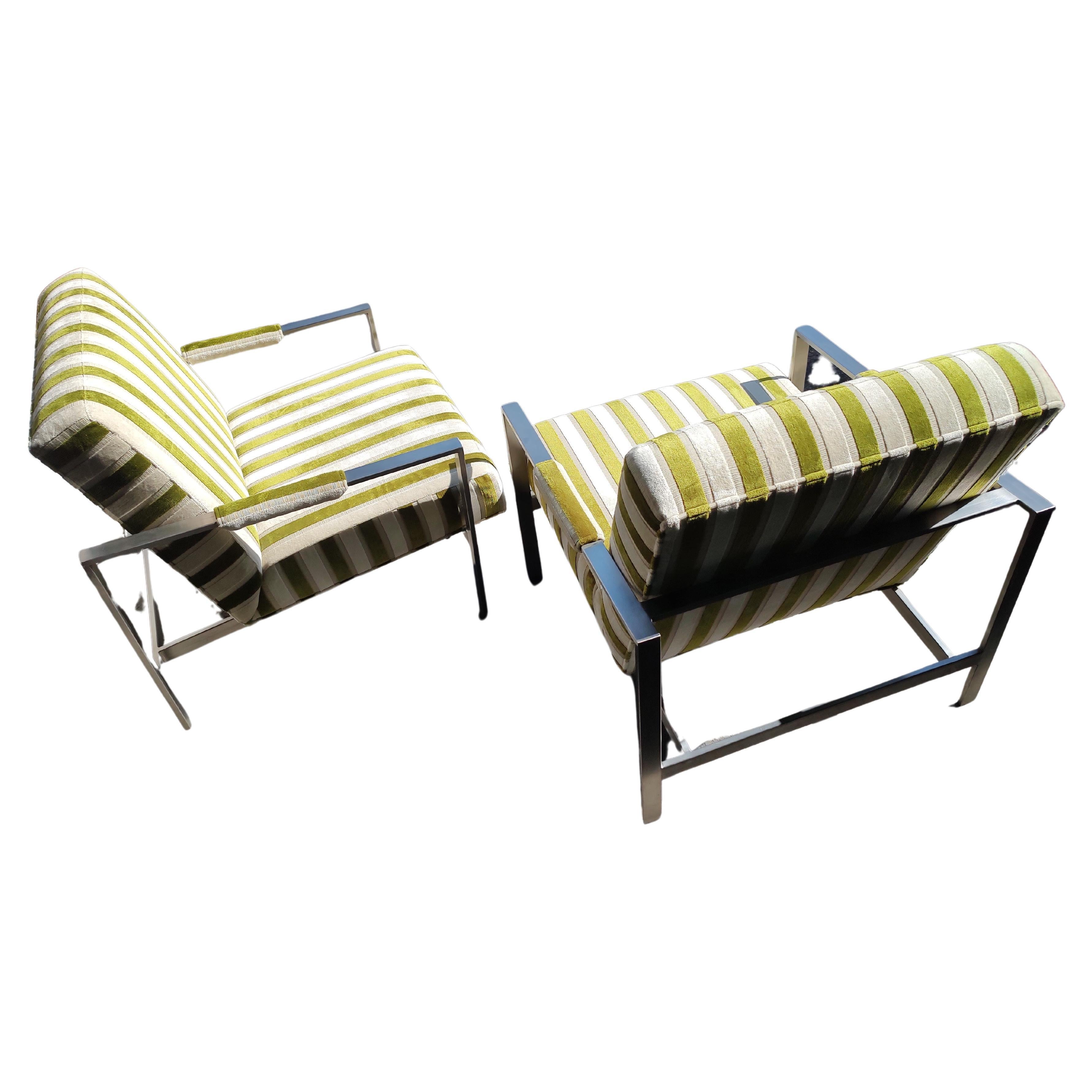 Fabulous pair of very elegant Mid-Century Modern style lounge chairs by Thayer Coggin with a definite influence by Milo Baughman. Striped green velvet with a pale ivory. Brushed stainless steel frames in excellent vintage condition with minimal