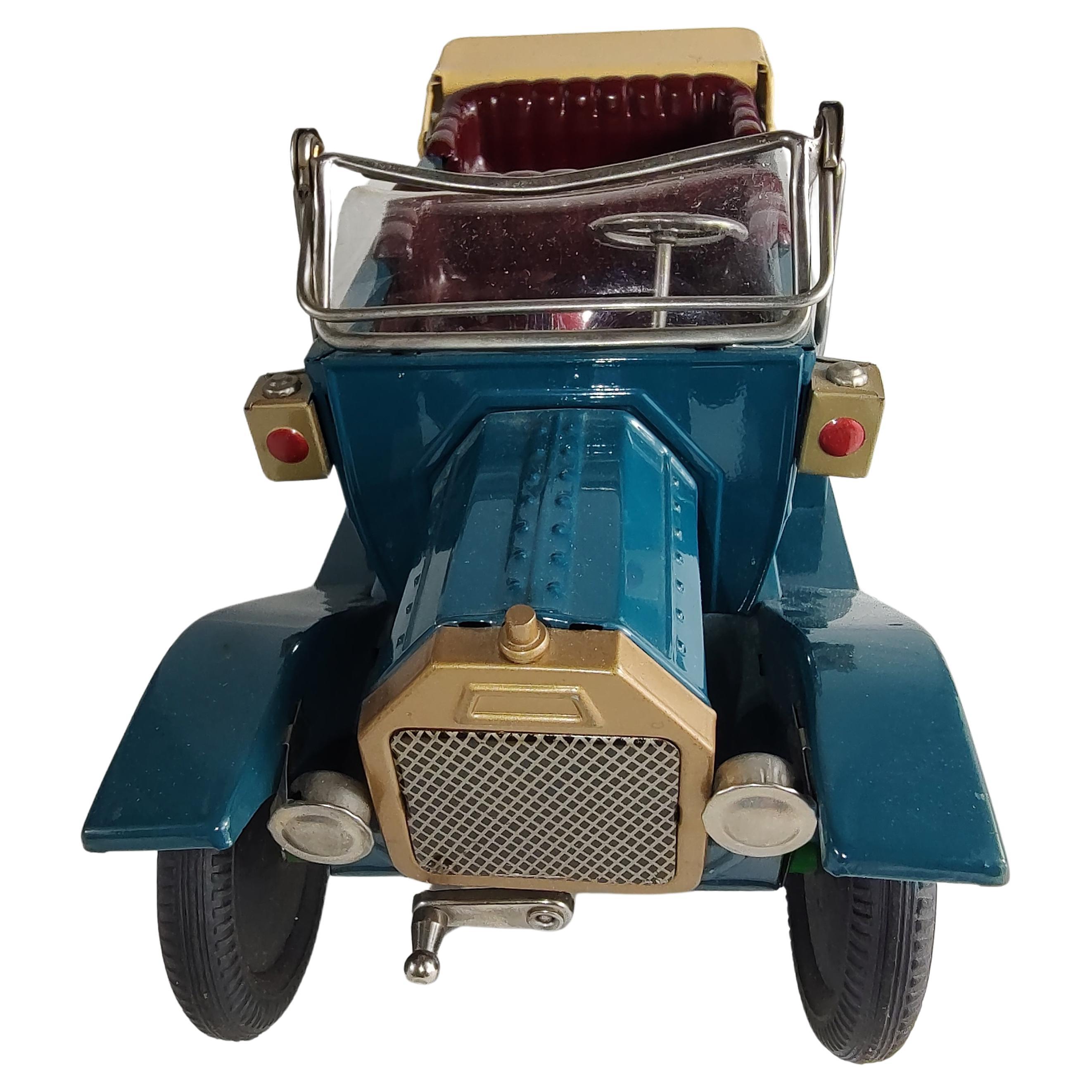 Japanese tin toy touring cars from the late 50s. In excellent antique condition, these toys were never played with. Friction cars, Near mint condition. Sat in boxes wrapped properly and stored in a heated home for over 60 years. Blue car is 9.5 x 4